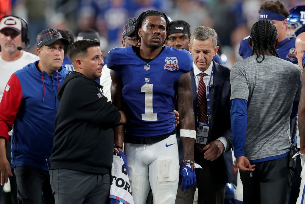 Sep 26, 2024; East Rutherford, New Jersey, USA; New York Giants wide receiver Malik Nabers (1) is helped off the field after an injury during the fourth quarter against the Dallas Cowboys at MetLife Stadium. Mandatory Credit: Brad Penner-Imagn Images