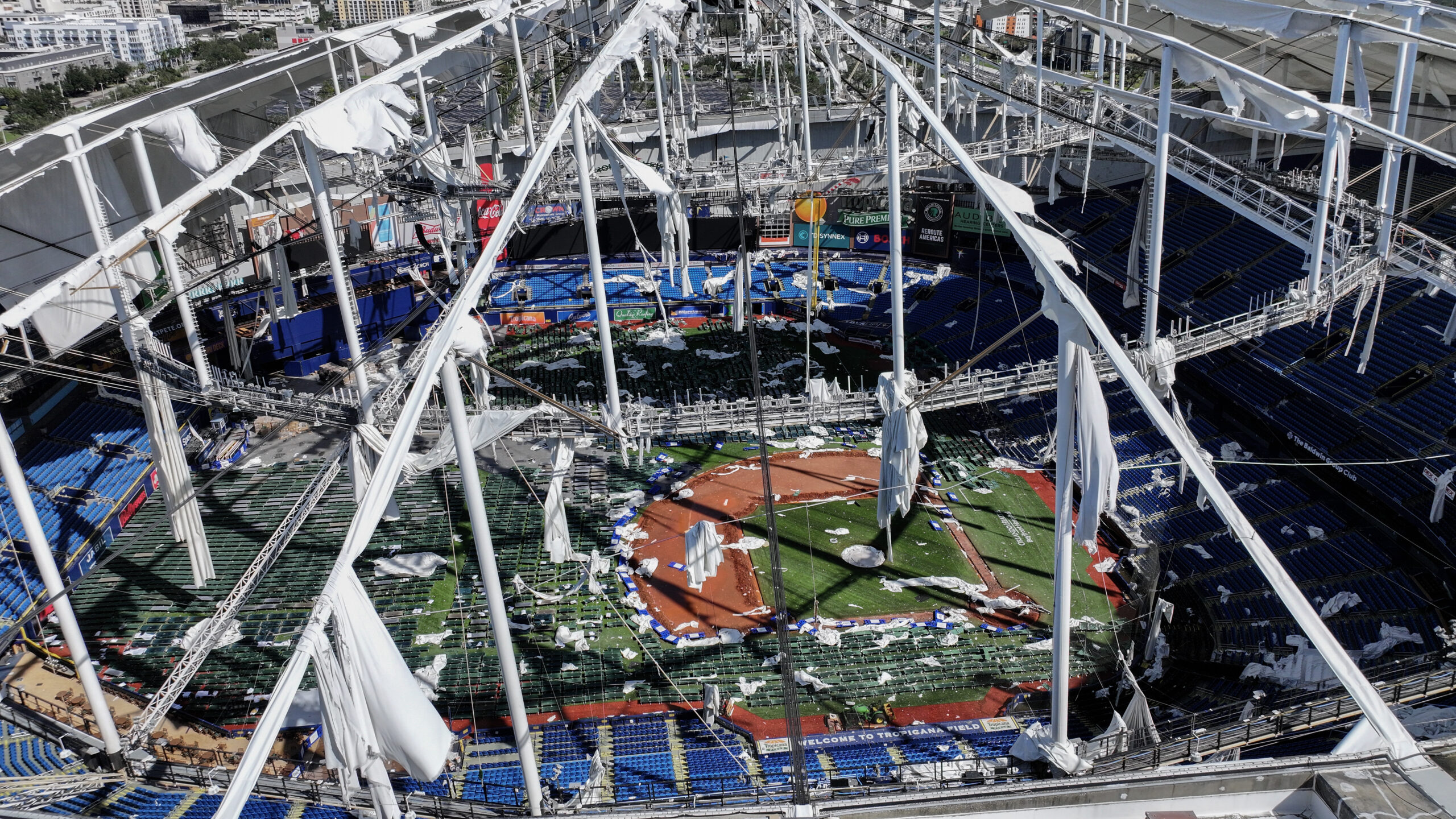 ST PETERSBURG - OCTOBER 10: In this aerial view, the roof of Tropicana Field is seen in tatters after Hurricane Milton destroyed it as the storm passed through the area on October 10, 2024, in St. Petersburg, Florida. The storm made landfall as a Category 3 hurricane in the Siesta Key area of Florida, causing damage and flooding throughout Central Florida. (Photo by Joe Raedle/Getty Images)