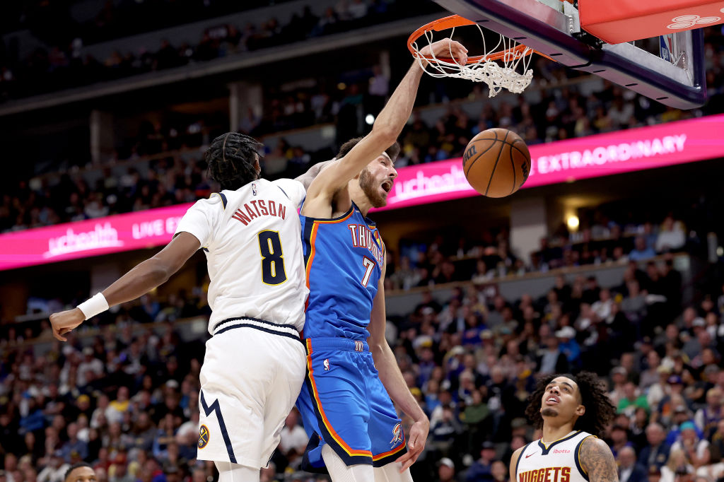 DENVER, COLORADO - OCTOBER 24: Chet Holmgren #7 of the Oklahoma City Thunder dunks on Peyton Watson #8 of the Denver Nuggets in the third quarter at Ball Arena on October 24, 2024 in Denver, Colorado. NOTE TO USER: User expressly acknowledges and agrees that, by downloading and or using this photograph, User is consenting to the terms and conditions of the Getty Images License Agreement. (Photo by Matthew Stockman/Getty Images)