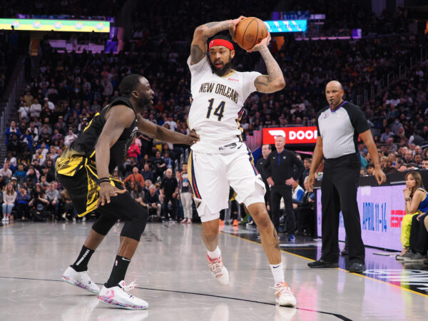 Mar 28, 2023; San Francisco, California, USA; New Orleans Pelicans small forward Brandon Ingram (14) controls the ball against Golden State Warriors center Draymond Green (23) during the fourth quarter at Chase Center.