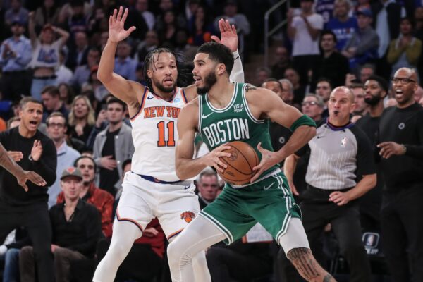 Oct 25, 2023; New York, New York, USA; Boston Celtics forward Jayson Tatum (0) is guarded by New York Knicks guard Jalen Brunson (11) while trying to make a pass in the fourth quarter at Madison Square Garden.