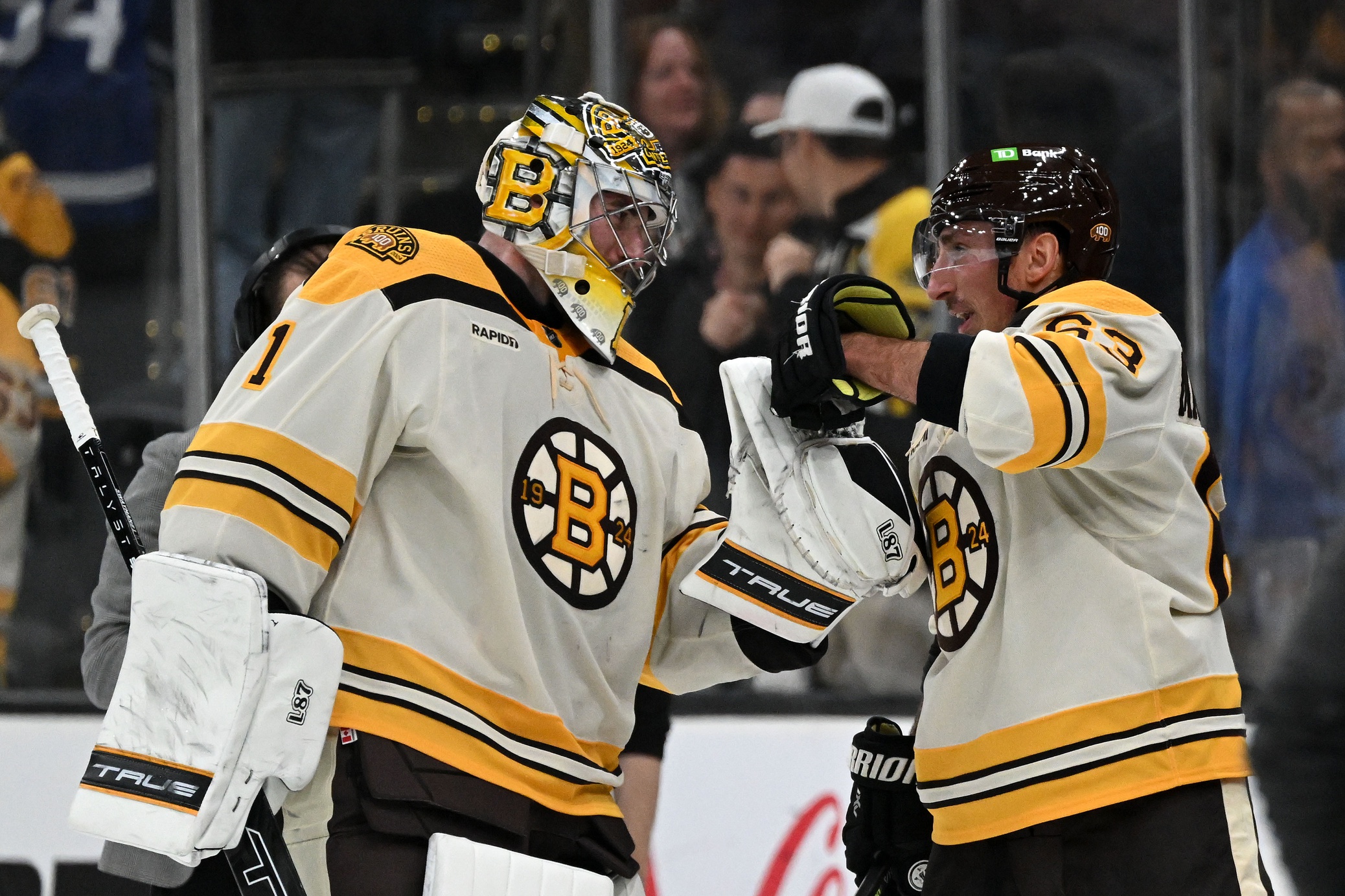 Nov 2, 2023; Boston, Massachusetts, USA; Boston Bruins left wing Brad Marchand (63) celebrates with goaltender Jeremy Swayman (1) after an overtime win against the Toronto Maple Leafs at the TD Garden. Mandatory Credit: Brian Fluharty-USA TODAY Sports