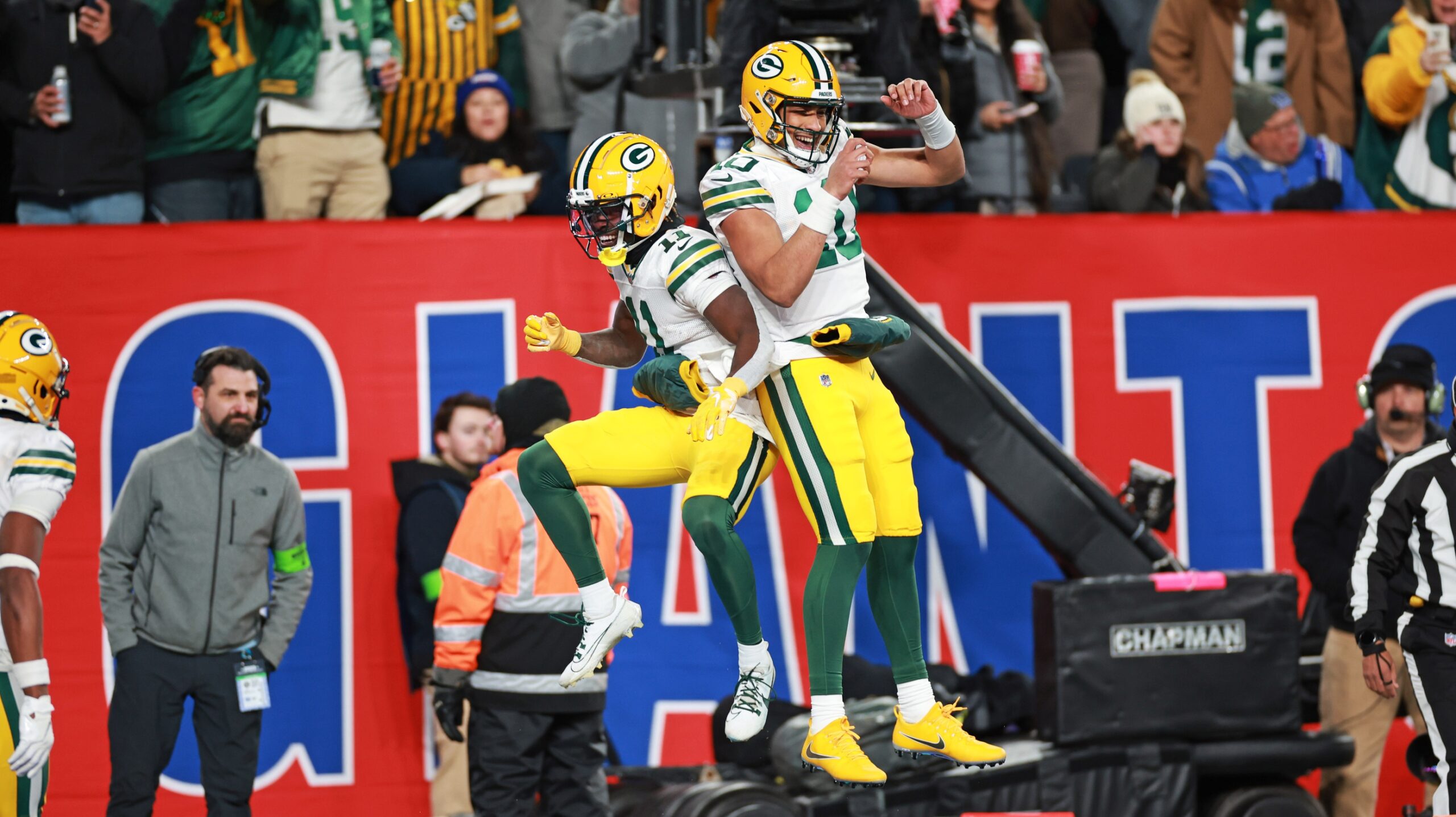 Dec 11, 2023; East Rutherford, New Jersey, USA; Green Bay Packers wide receiver Jayden Reed (11) and Green Bay Packers quarterback Jordan Love (10) celebrate after a touchdown during the second quarter against the New York Giants at MetLife Stadium. Mandatory Credit: Vincent Carchietta-USA TODAY Sports