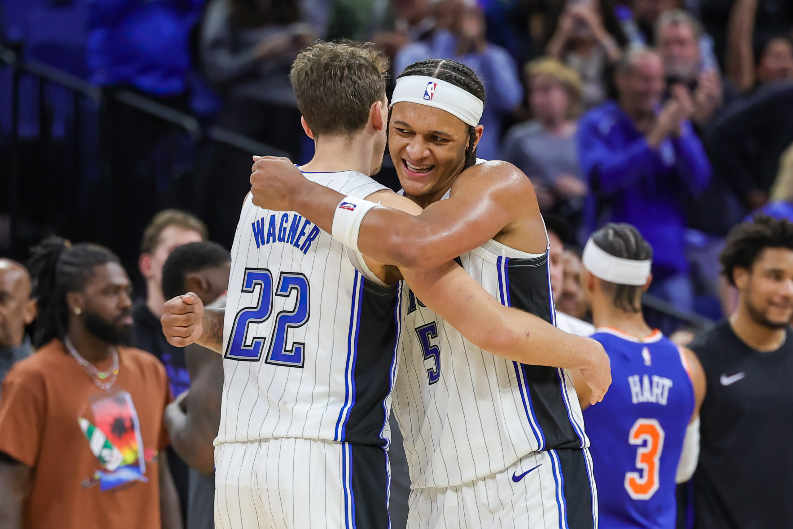 Dec 29, 2023; Orlando, Florida, USA; Orlando Magic forward Franz Wagner (22) and forward Paolo Banchero (5) celebrate their 117-108 win against the New York Knicks at KIA Center.