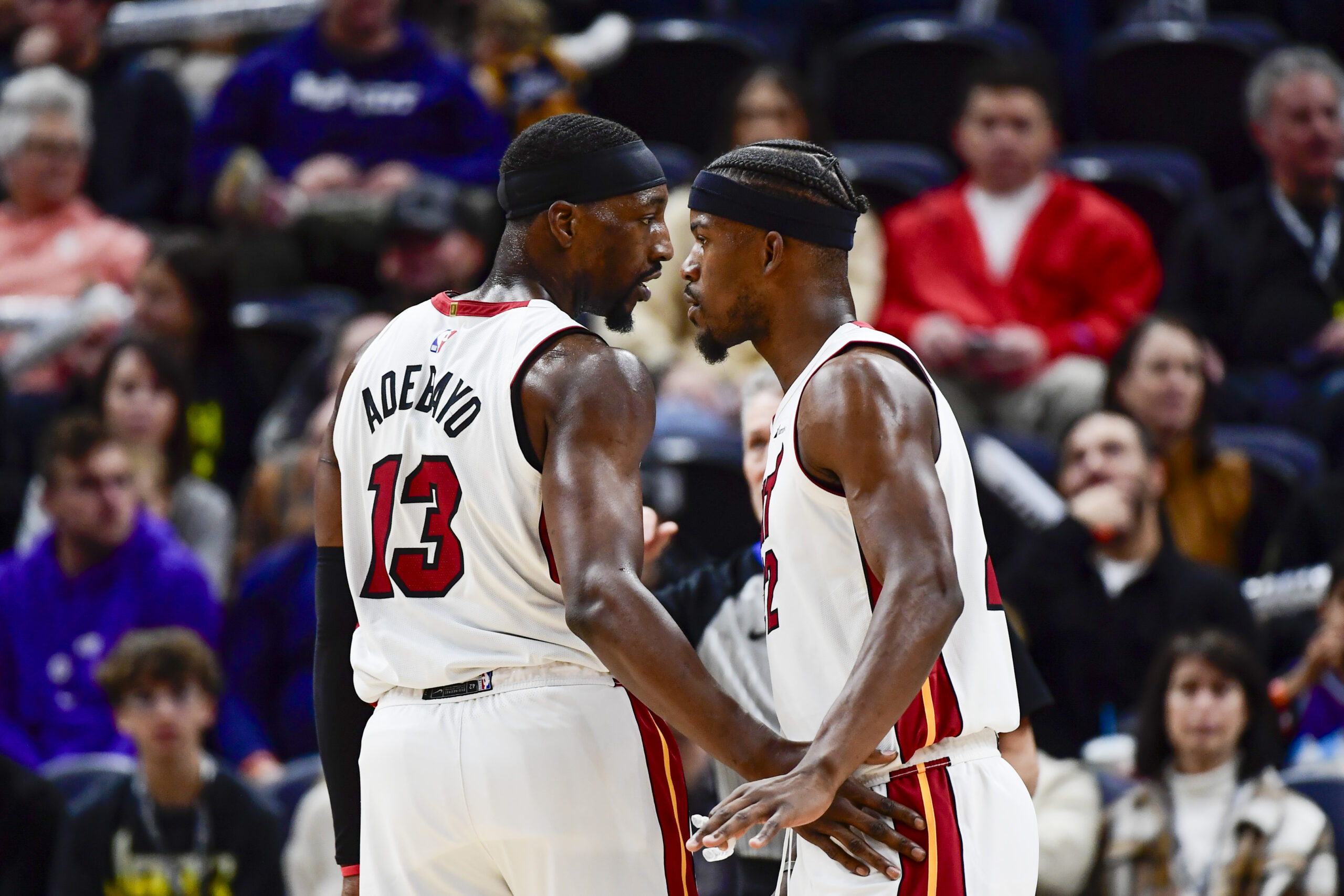 Dec 31, 2022; Salt Lake City, Utah, USA; Miami Heat forward Jimmy Butler (22) and center/forward Bam Adebayo (13) talk before a free-throw shot against the Utah Jazz during the second half at Vivint Arena.