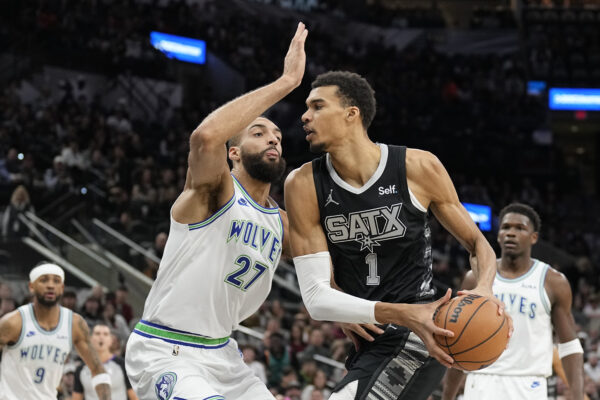 Jan 27, 2024; San Antonio, Texas, USA; San Antonio Spurs forward Victor Wembanyama (1) drives to the basket against the Minnesota Timberwolves center Rudy Gobert (27) during the first half at Frost Bank Center.