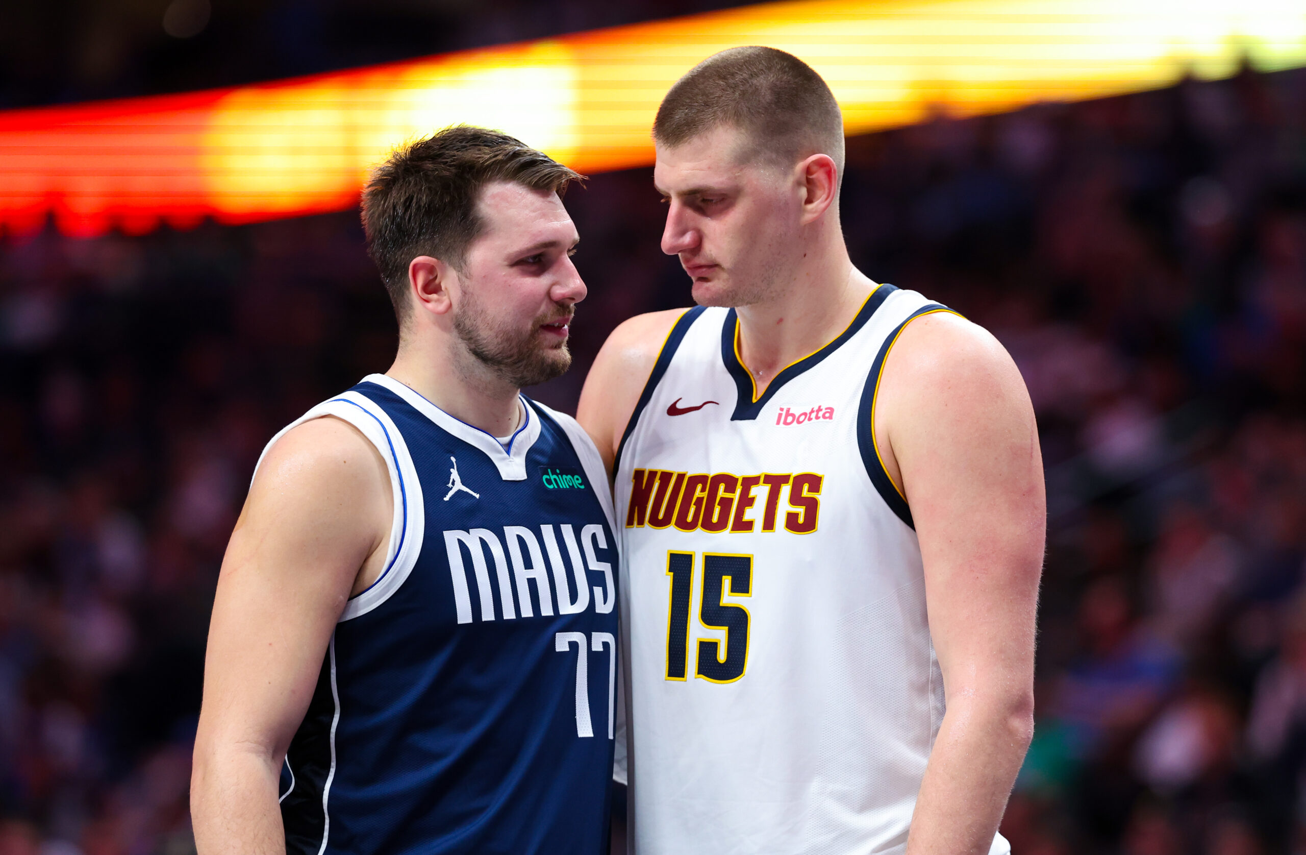 Mar 17, 2024; Dallas, Texas, USA; NBA; Dallas Mavericks guard Luka Doncic (77) speaks with Denver Nuggets center Nikola Jokic (15) during the second half at American Airlines Center.