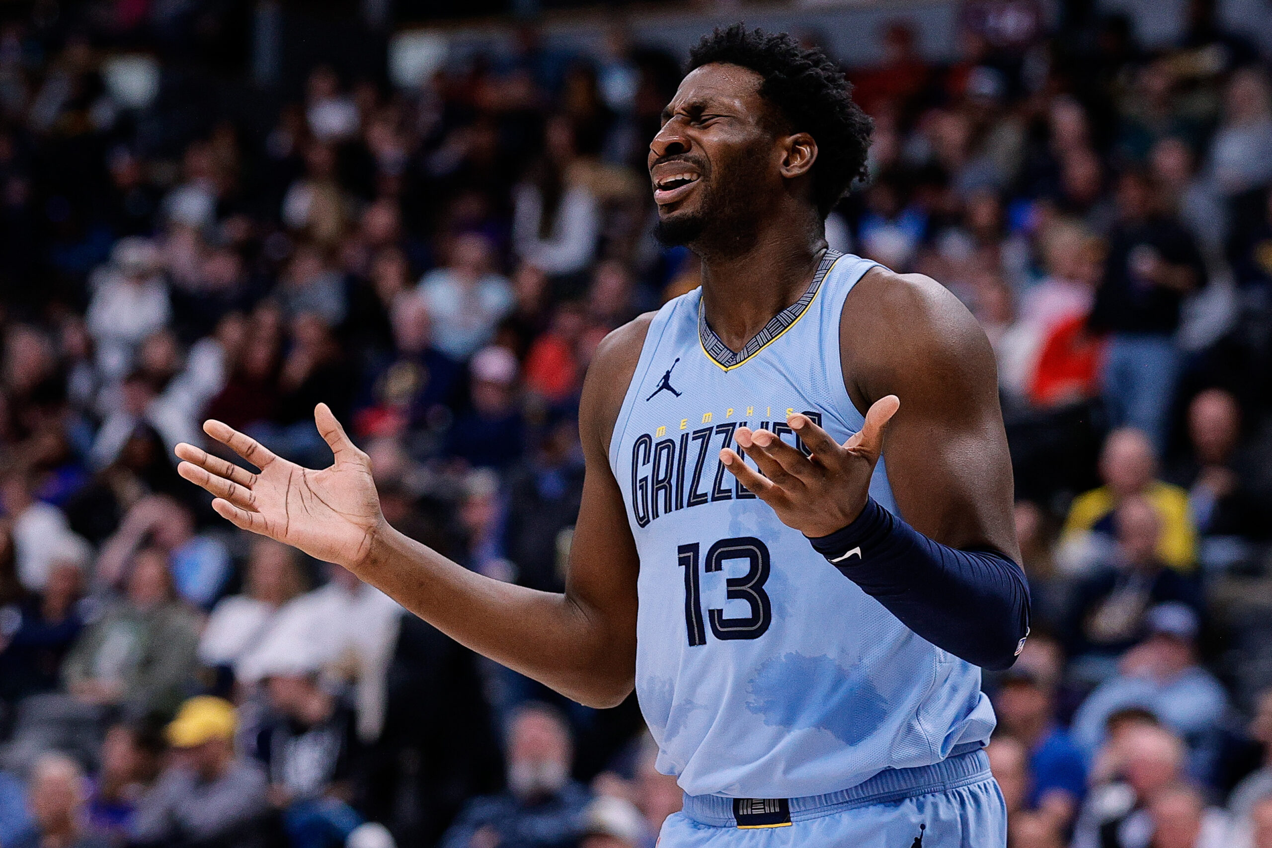 Mar 25, 2024; Denver, Colorado, USA; Memphis Grizzlies forward Jaren Jackson Jr. (13) reacts after a call in the third quarter against the Denver Nuggets at Ball Arena.