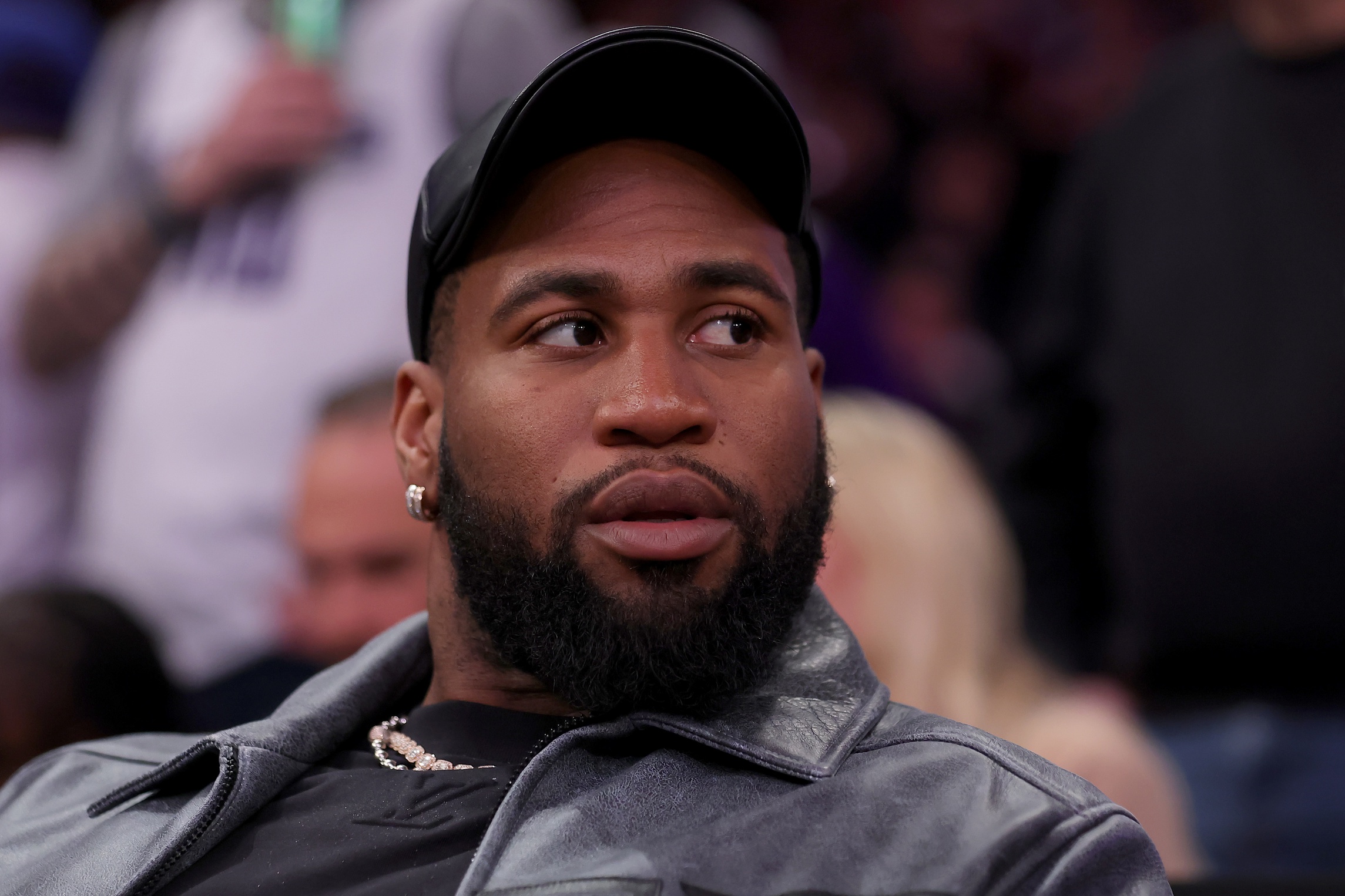 Apr 4, 2024; New York, New York, USA; New York Jets linebacker Haason Reddick sits court side during the fourth quarter between the New York Knicks and the Sacramento Kings at Madison Square Garden. Mandatory Credit: Brad Penner-USA TODAY Sports