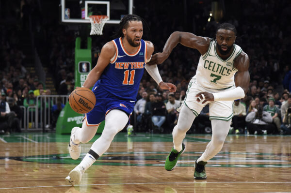 Apr 11, 2024; Boston, Massachusetts, USA; New York Knicks guard Jalen Brunson (11) controls the ball while Boston Celtics guard Jaylen Brown (7) defends during the first half at TD Garden.