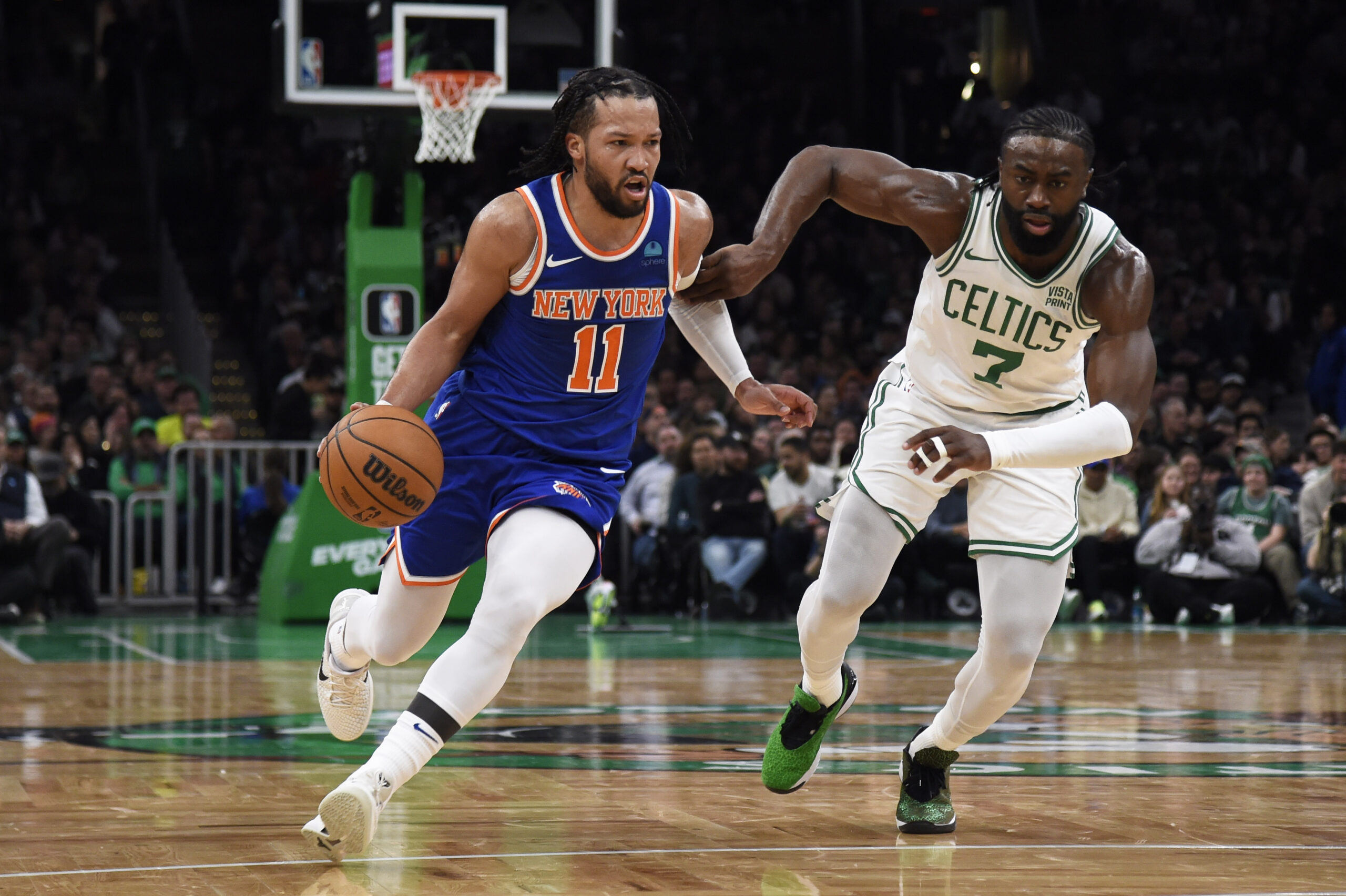 Apr 11, 2024; Boston, Massachusetts, USA; New York Knicks guard Jalen Brunson (11) controls the ball while Boston Celtics guard Jaylen Brown (7) defends during the first half at TD Garden.