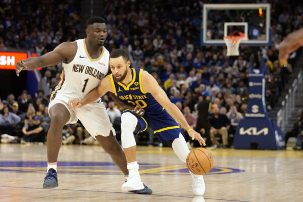 Apr 12, 2024; San Francisco, California, USA; Golden State Warriors guard Stephen Curry (30) dribbles around New Orleans Pelicans forward Zion Williamson (1) during the fourth quarter at Chase Center.