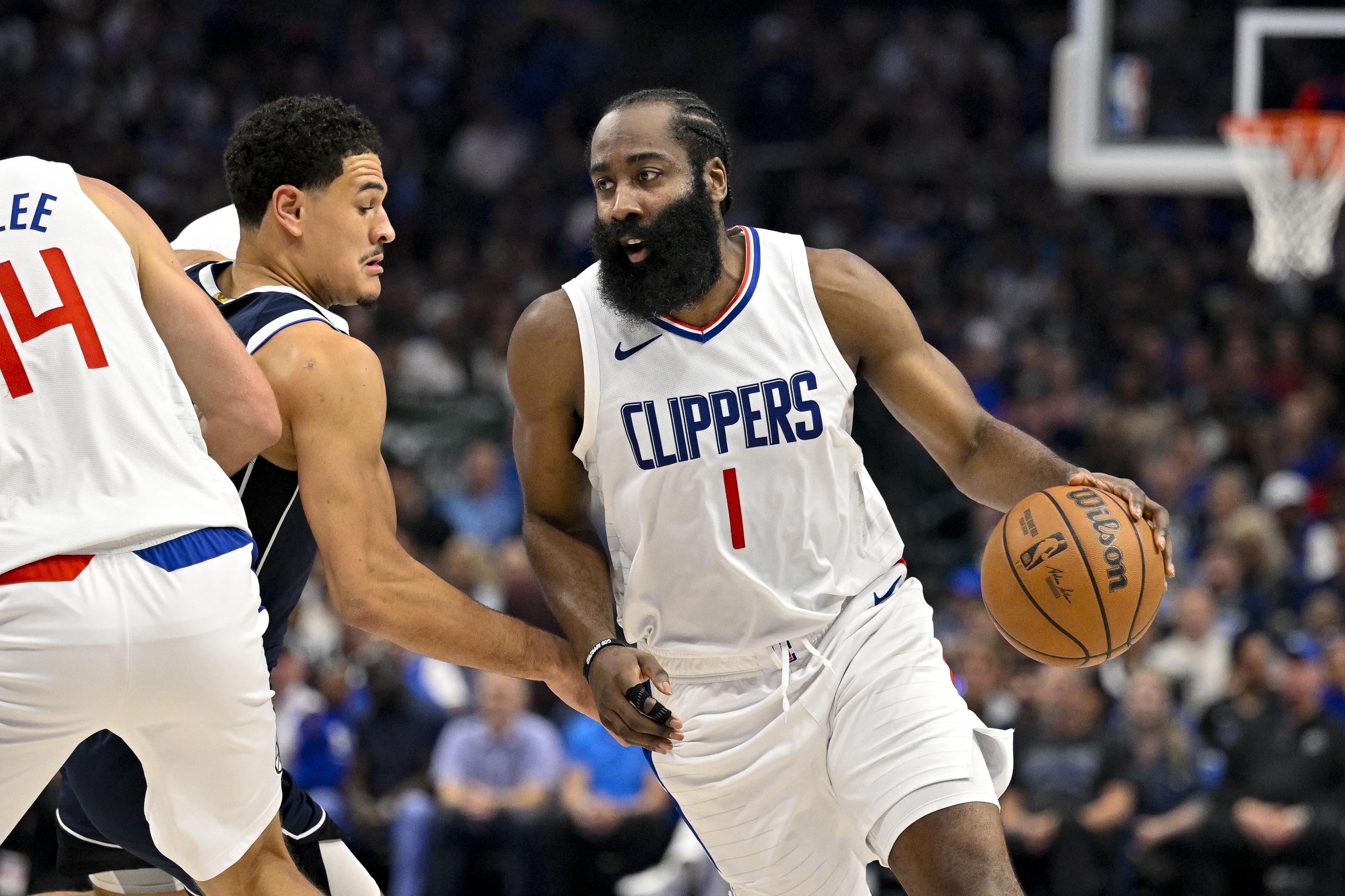 Apr 26, 2024; Dallas, Texas, USA; LA Clippers guard James Harden (1) looks to move the ball past Dallas Mavericks guard Josh Green (8) during the second quarter during game three of the first round for the 2024 NBA playoffs at the American Airlines Center. Mandatory Credit: Jerome Miron-USA TODAY Sports