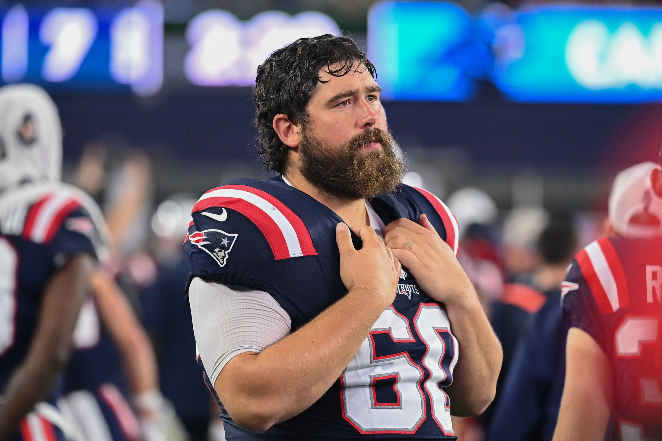 August 8, 2024; Foxborough, MA, USA; New England Patriots center David Andrews (60) watches from the sideline during the first half against the Carolina Panthers at Gillette Stadium. Mandatory Credit: Eric Canha-USA TODAY Sports