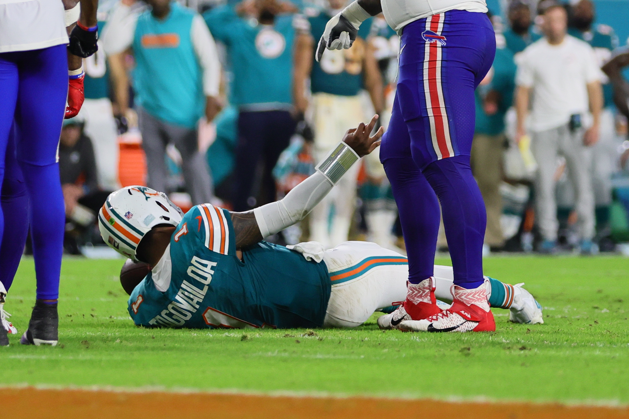 Sep 12, 2024; Miami Gardens, Florida, USA; Miami Dolphins quarterback Tua Tagovailoa (1) reacts after an apparent injury against the Buffalo Bills during the third quarter at Hard Rock Stadium. Mandatory Credit: Sam Navarro-Imagn Images