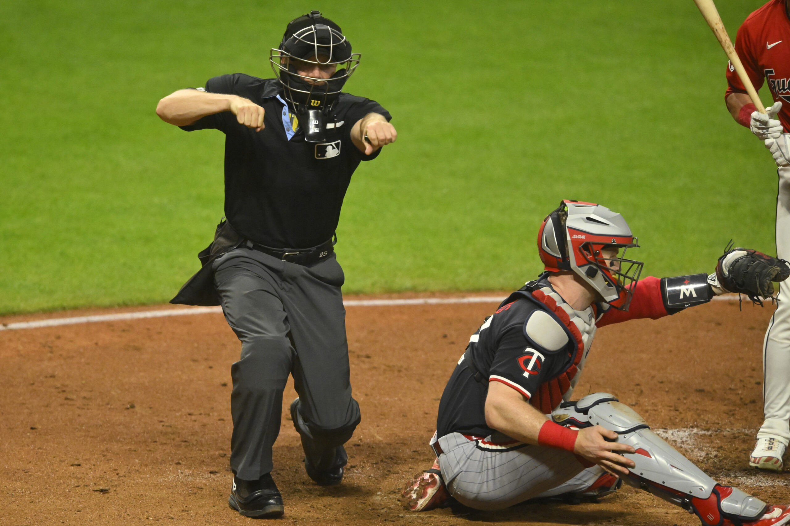 MLB - Sep 17, 2024; Cleveland, Ohio, USA; Umpire Junior Valentine (25) calls a third strike during a game between the Cleveland Guardians and the Kansas City Royals at Progressive Field. Mandatory Credit: David Richard-Imagn Images