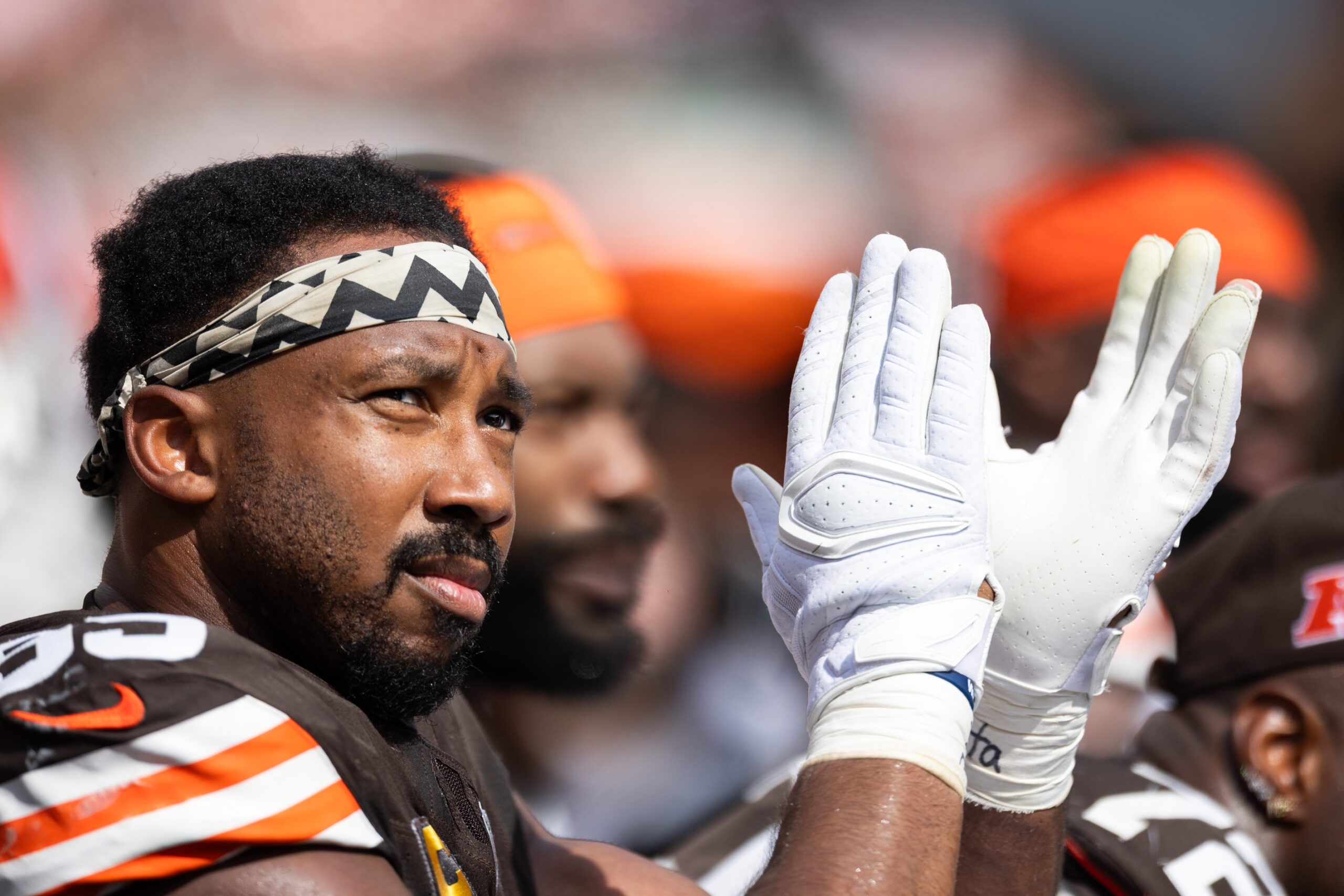 Sep 22, 2024; Cleveland, Ohio, USA; Cleveland Browns defensive end Myles Garrett (95) claps while watching the game from the bench during the second quarter against the New York Giants at Huntington Bank Field. Mandatory Credit: Scott Galvin-Imagn Images