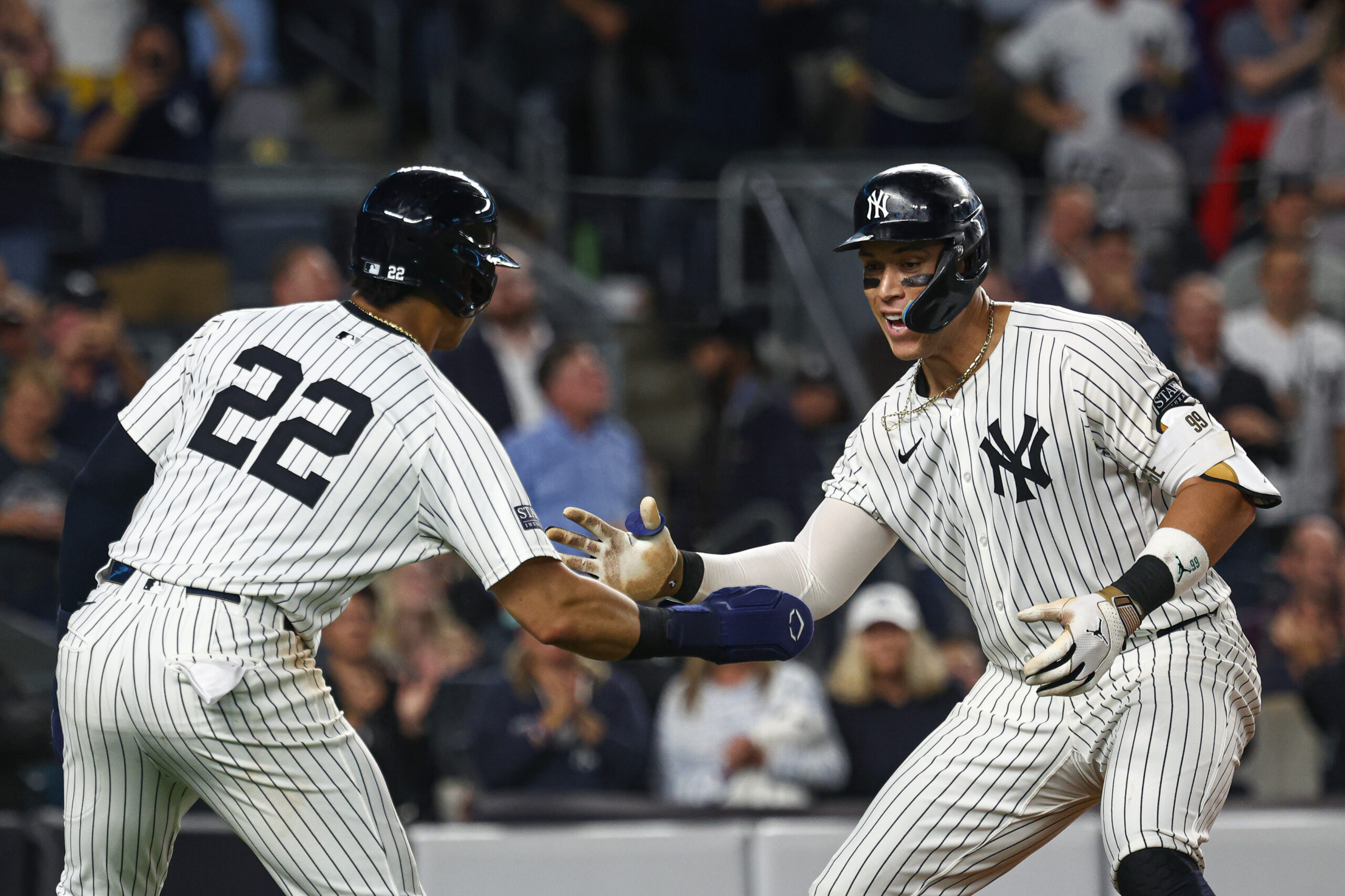 Sep 26, 2024; Bronx, New York, USA; New York Yankees center fielder Aaron Judge (99) celebrates with right fielder Juan Soto (22) after hitting a two run home run during the seventh inning against the Baltimore Orioles at Yankee Stadium. Mandatory Credit: Vincent Carchietta-Imagn Images