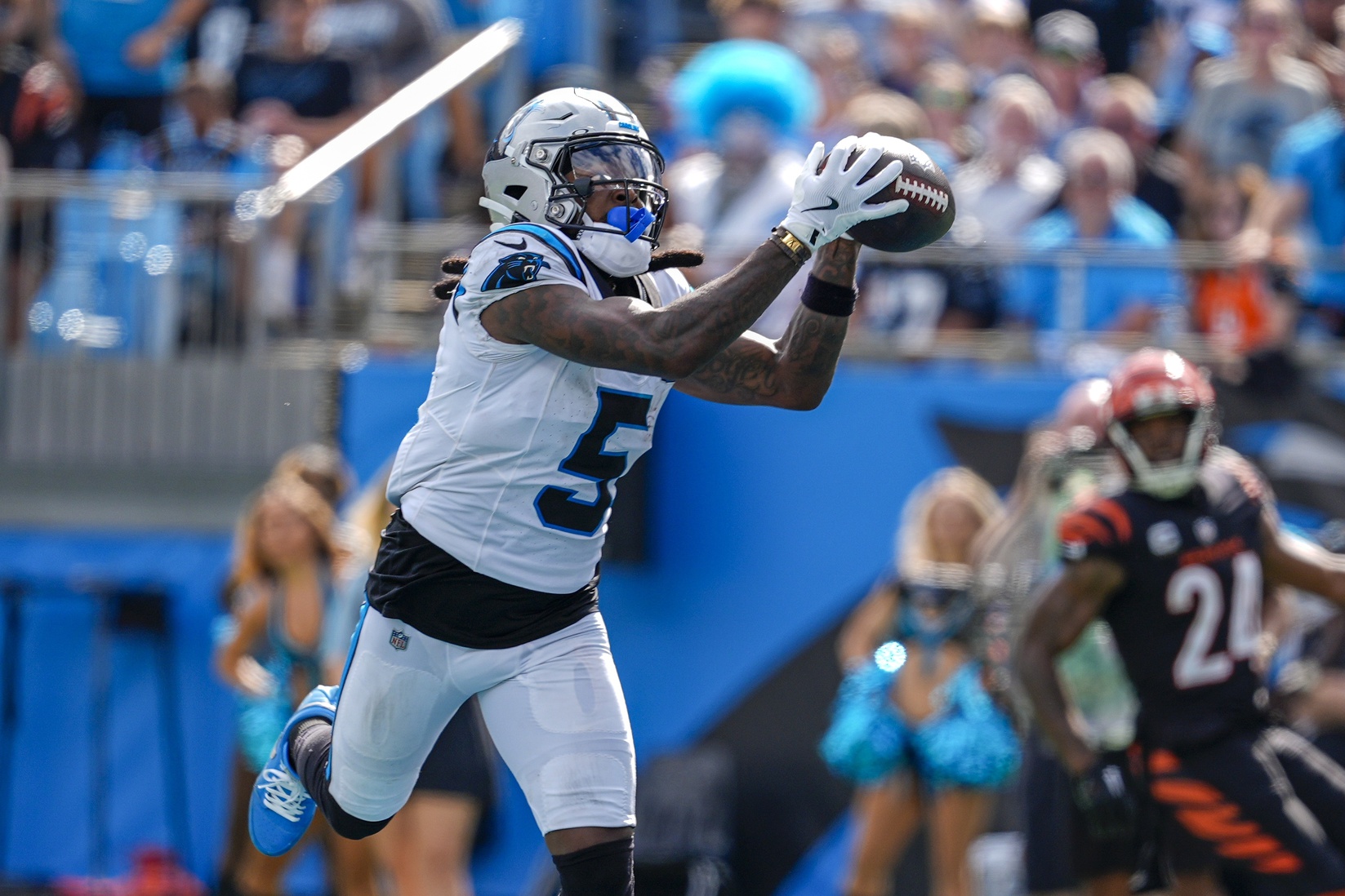 Sep 29, 2024; Charlotte, North Carolina, USA; Carolina Panthers wide receiver Diontae Johnson (5) catches a pass from quarterback Andy Dalton (14) for a touchdown during the third quarter at Bank of America Stadium. Mandatory Credit: Jim Dedmon-Imagn Images