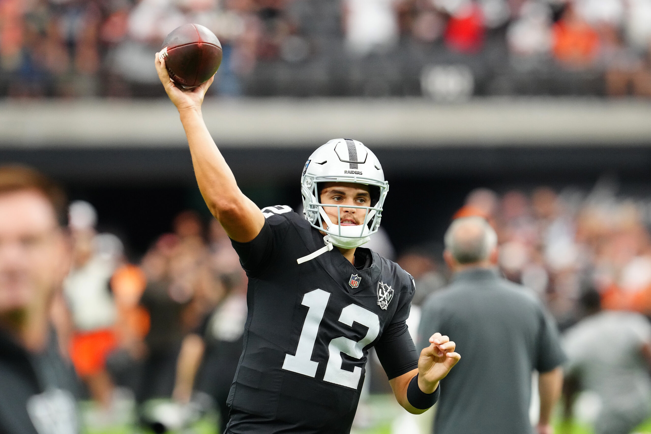 Sep 29, 2024; Paradise, Nevada, USA; Las Vegas Raiders quarterback Aidan O'Connell (12) warms up before a game against the Cleveland Browns at Allegiant Stadium. Mandatory Credit: Stephen R. Sylvanie-Imagn Images