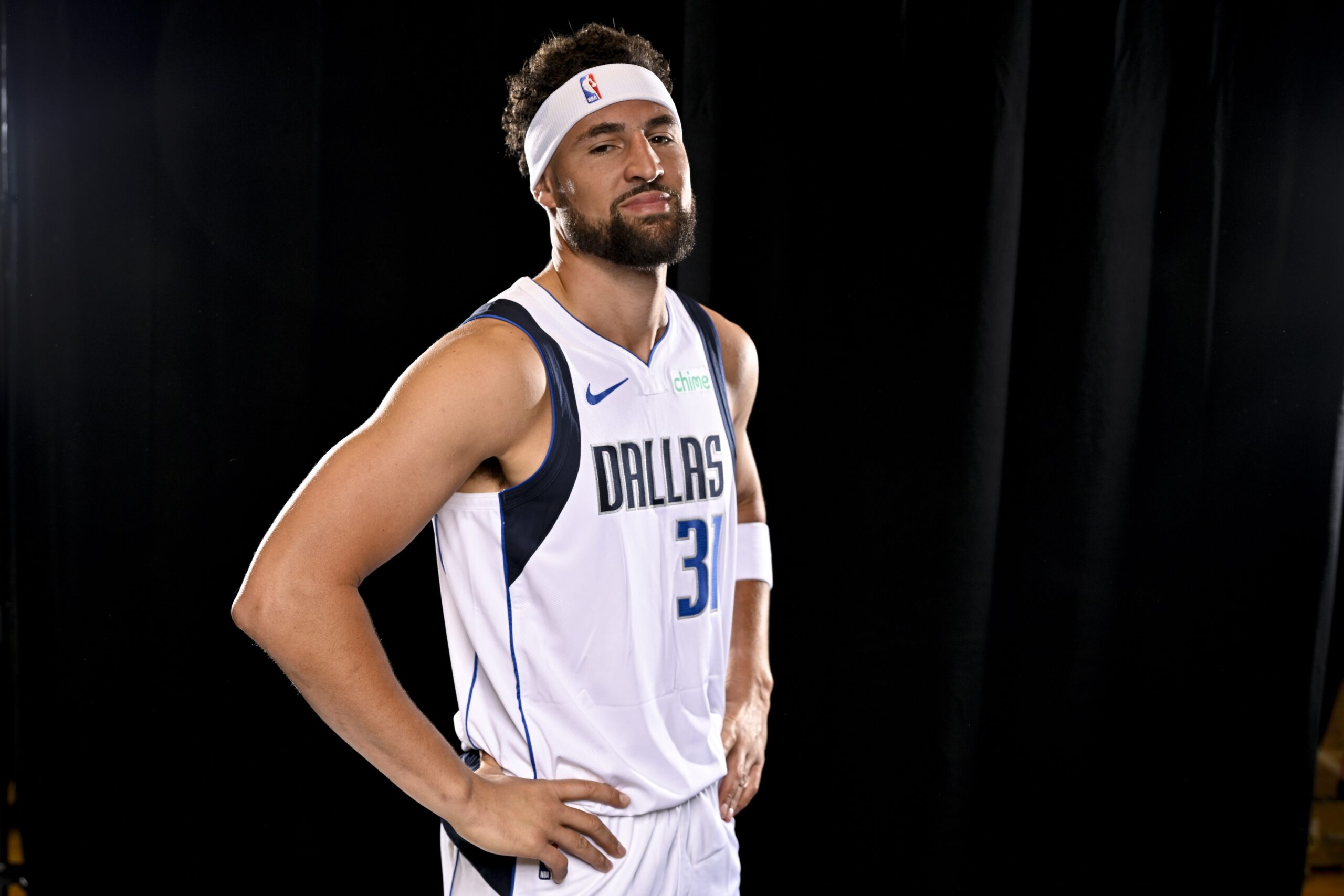 Sep 30, 2024; Dallas, TX, USA; Dallas Mavericks guard Klay Thompson (31) poses for a photo during the 2024 Dallas Mavericks media day. Mandatory Credit: Jerome Miron-Imagn Images