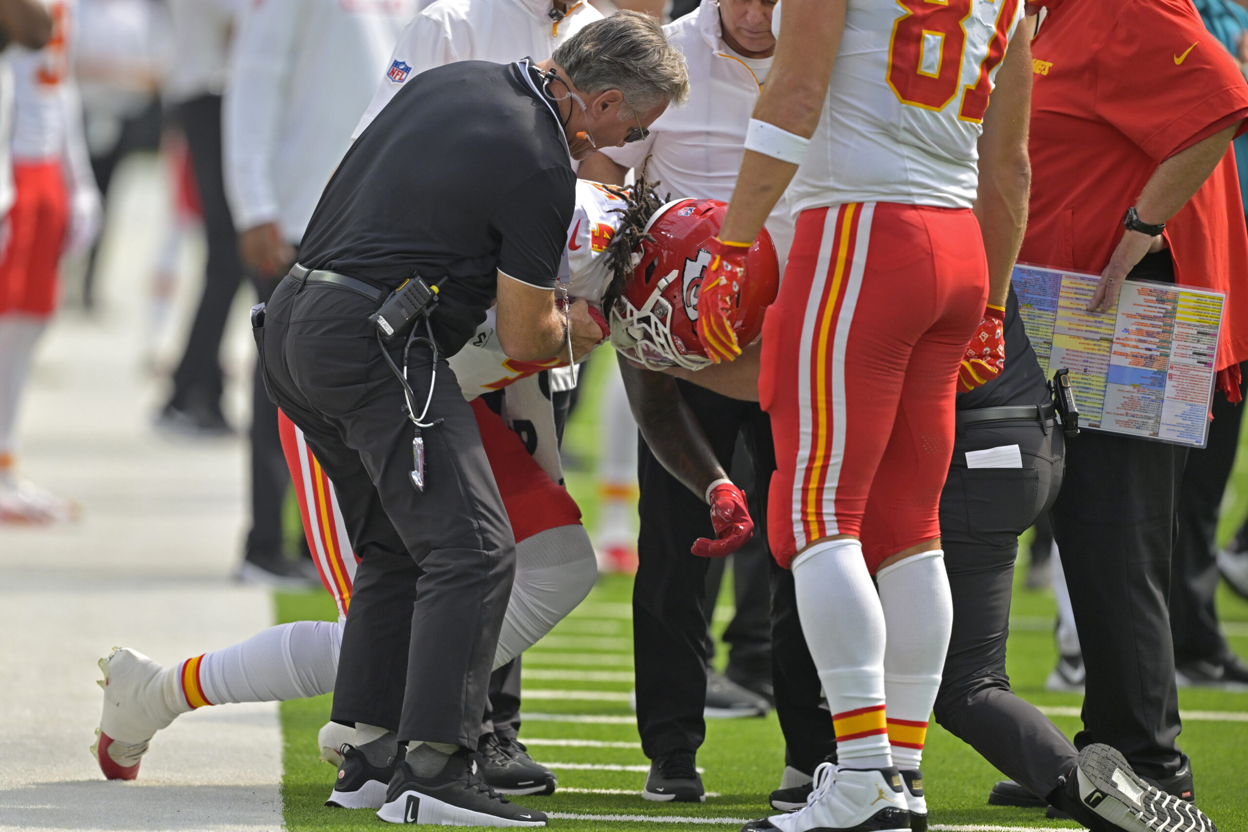 Sep 29, 2024; Inglewood, California, USA; Kansas City Chiefs wide receiver Rashee Rice (4) is assisted by medical staff after an injury in the first half against the Los Angeles Chargers at SoFi Stadium. Mandatory Credit: Jayne Kamin-Oncea-Imagn Images