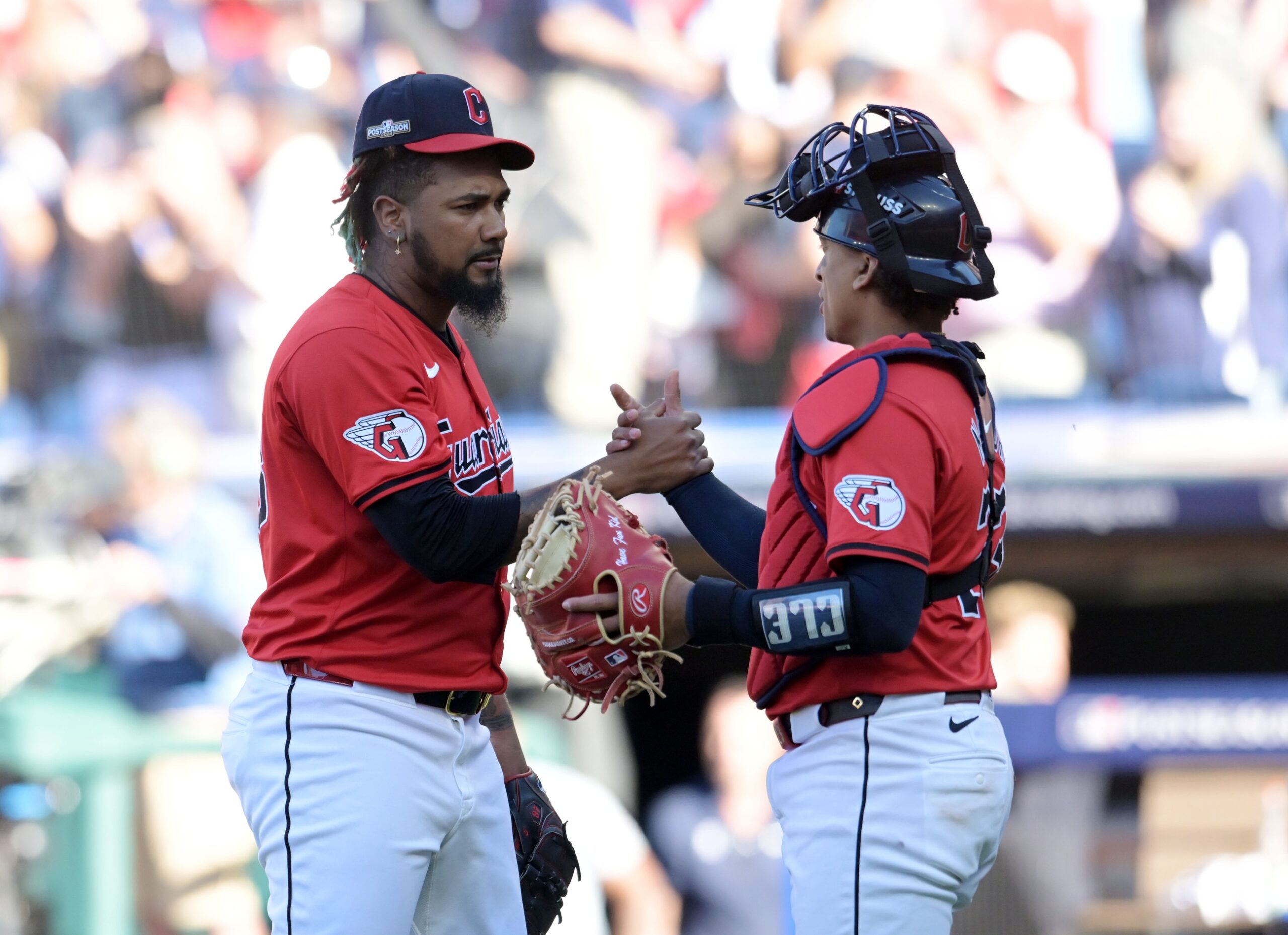 Oct 5, 2024; Cleveland, Ohio, USA; Cleveland Guardians pitcher Emmanuel Clase (48) and Cleveland Guardians catcher Bo Naylor (23) celebrate after defeating the Detroit Tigers in game one of the ALDS for the 2024 MLB Playoffs at Progressive Field. Mandatory Credit: Ken Blaze-Imagn Images