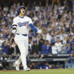 Oct 5, 2024; Los Angeles, California, USA; Los Angeles Dodgers designated hitter Shohei Ohtani (17) scores a home run against the San Diego Padres during game one of the NLDS for the 2024 MLB Playoffs at Dodger Stadium.