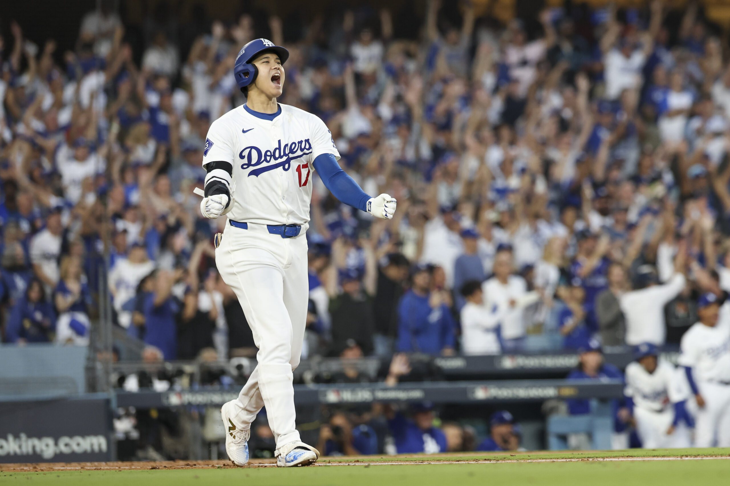 Oct 5, 2024; Los Angeles, California, USA; Los Angeles Dodgers designated hitter Shohei Ohtani (17) scores a home run against the San Diego Padres during game one of the NLDS for the 2024 MLB Playoffs at Dodger Stadium.