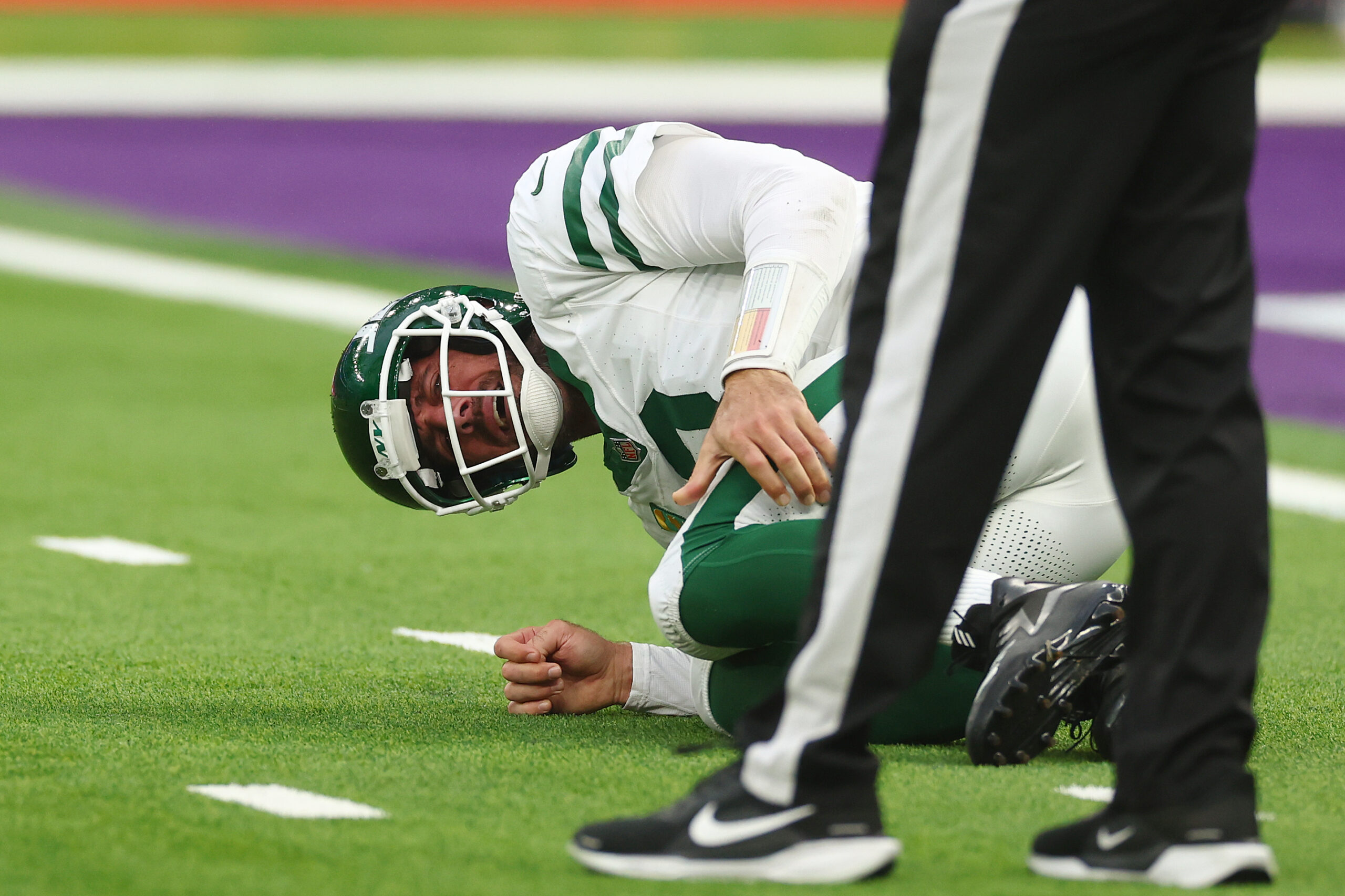 Oct 6, 2024; Tottenham, ENG; New York Jets quarterback Aaron Rodgers (8) suffers an injury after a tackle from Minnesota Vikings Linebacker Patrick Jones II (91) in the 3rd Quarter at Tottenham Hotspur Stadium. Mandatory Credit: Shaun Brooks-Imagn Images