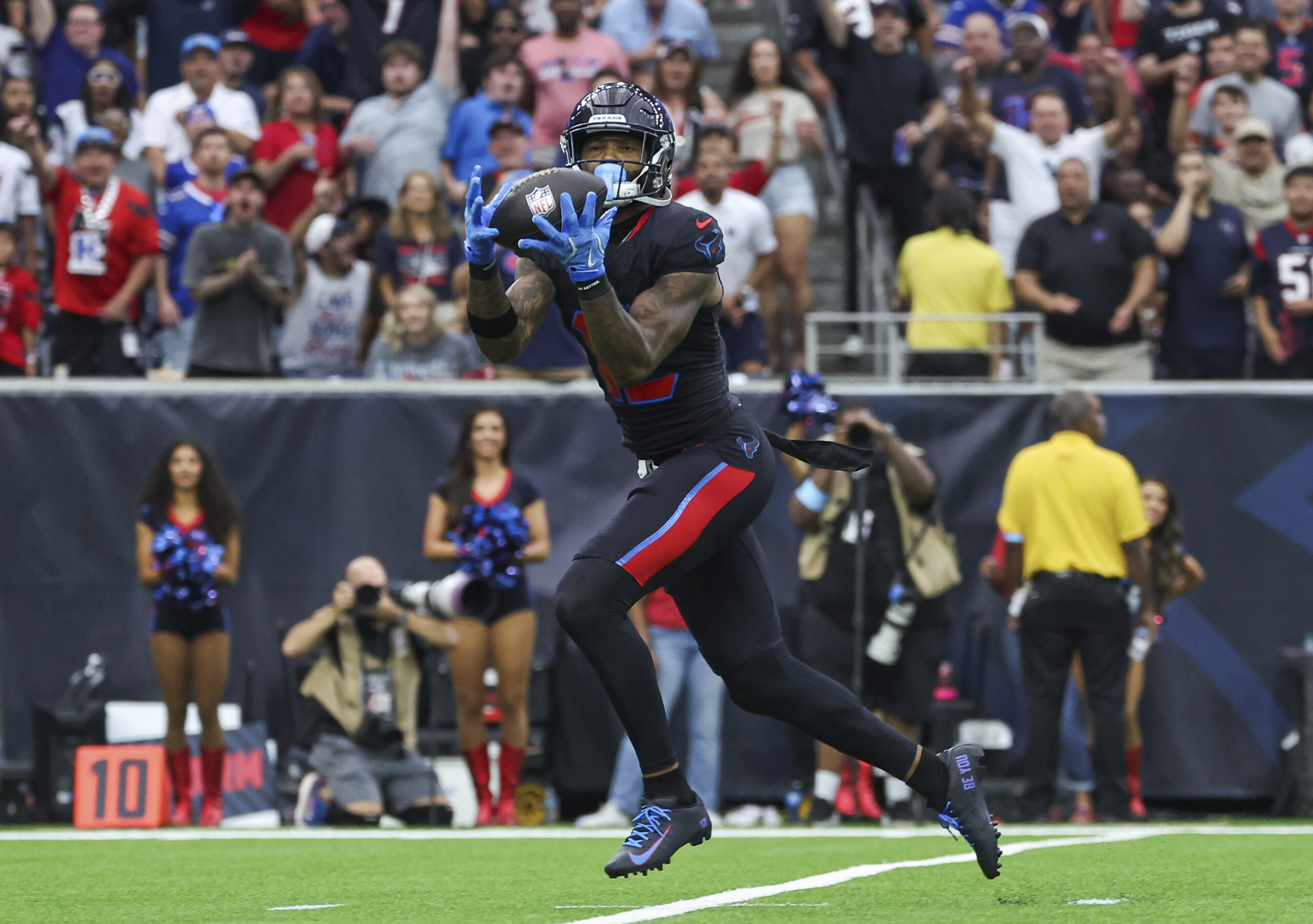 Oct 6, 2024; Houston, Texas, USA; Houston Texans wide receiver Nico Collins (12) makes a reception for a touchdown during the first quarter against the Buffalo Bills at NRG Stadium. Mandatory Credit: Troy Taormina-Imagn Images