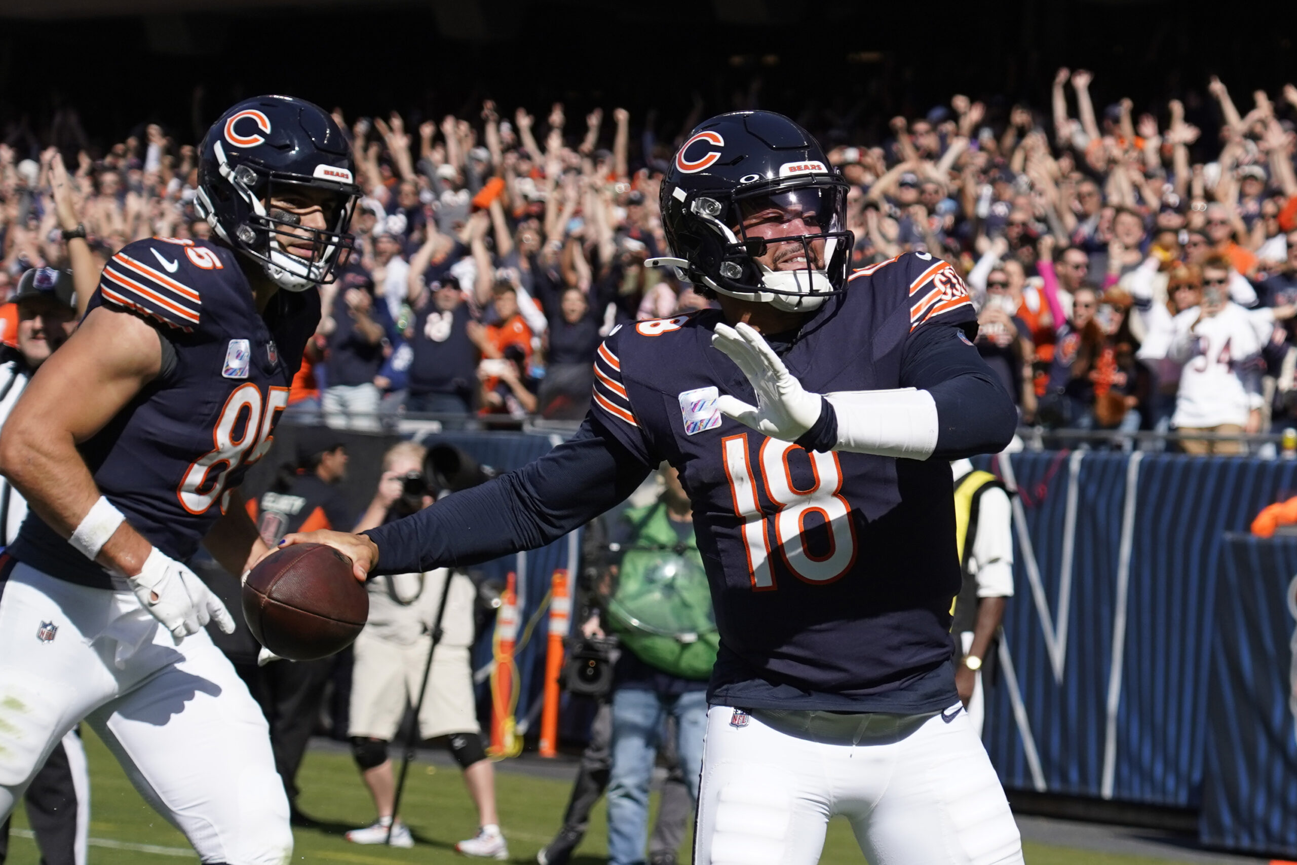 Oct 6, 2024; Chicago, Illinois, USA; Chicago Bears quarterback Caleb Williams (18) runs for a touchdown that was called back because of a penalty against the Carolina Panthers during the second half at Soldier Field.