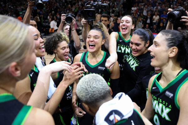 Oct 8, 2024; Minneapolis, Minnesota, USA; Minnesota Lynx guard Kayla McBride (21) celebrates with her teammates after their win against the Connecticut Sun during game five of the 2024 WNBA playoffs at Target Center.