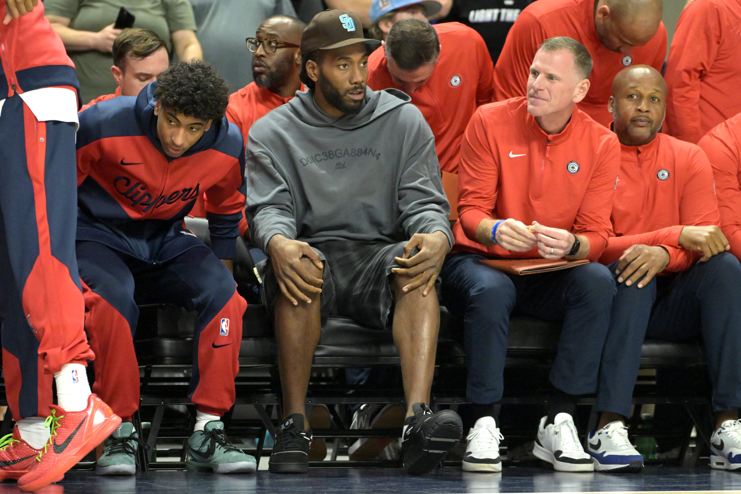 Oct 8, 2024; Oceanside, California, USA; Los Angeles Clippers forward Kawhi Leonard (2) looks on from the bench during a preseason game against the Brooklyn Nets at Frontwave Arena.