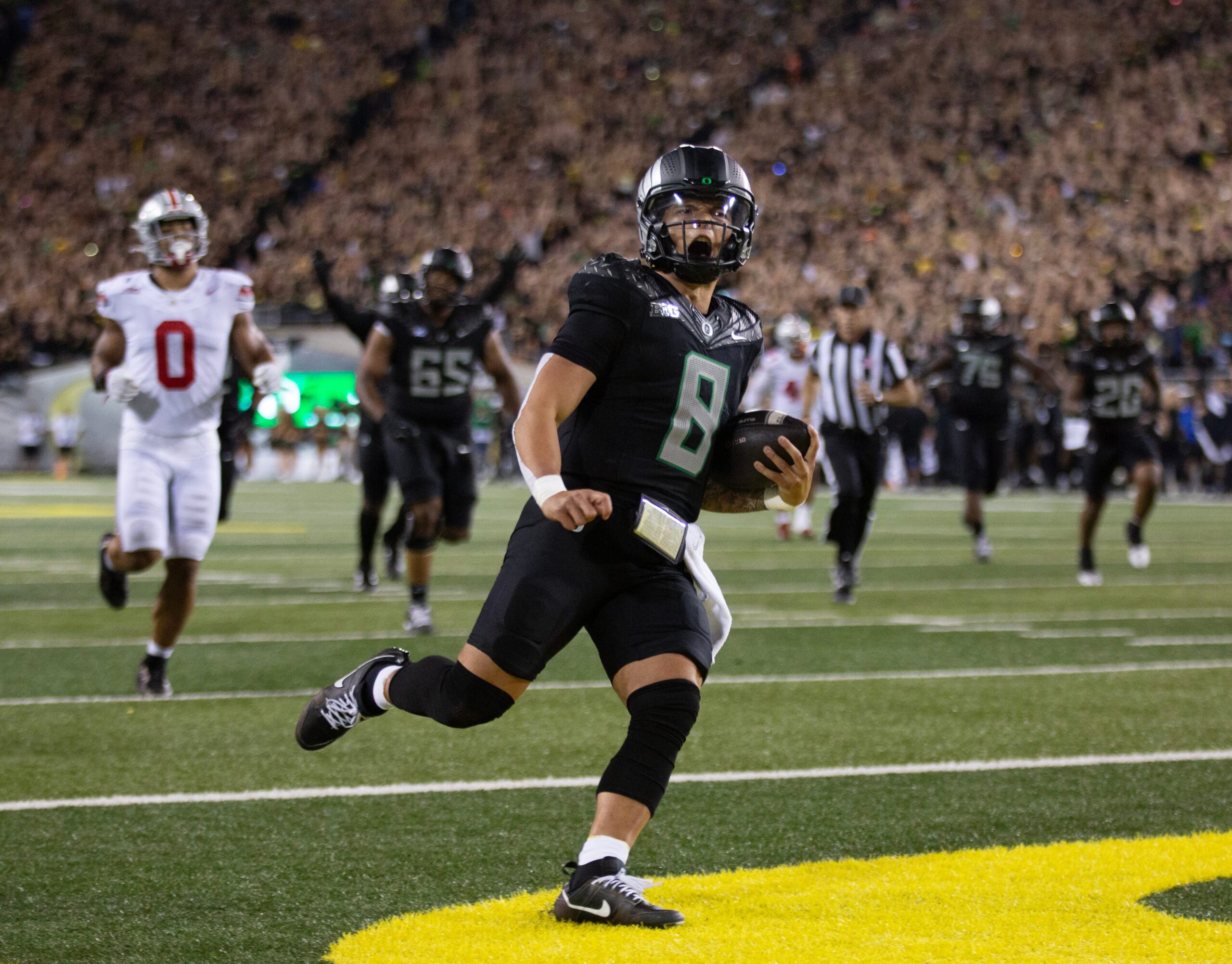 Oregon quarterback Dillon Gabriel scores a touchdown against Ohio State in the fourth quarter at Autzen Stadium Saturday, Oct. 12, 2024. Syndication: The Register Guard