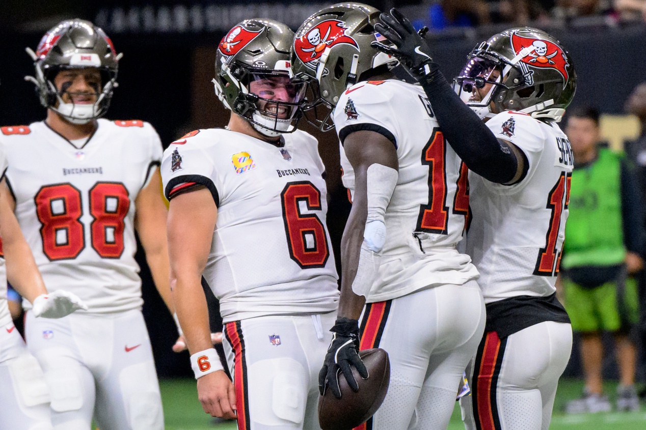 Oct 13, 2024; New Orleans, Louisiana, USA; Tampa Bay Buccaneers quarterback Baker Mayfield (6) celebrates the touchdown reception of Tampa Bay Buccaneers wide receiver Chris Godwin (14) during the first quarter against the New Orleans Saints at Caesars Superdome.