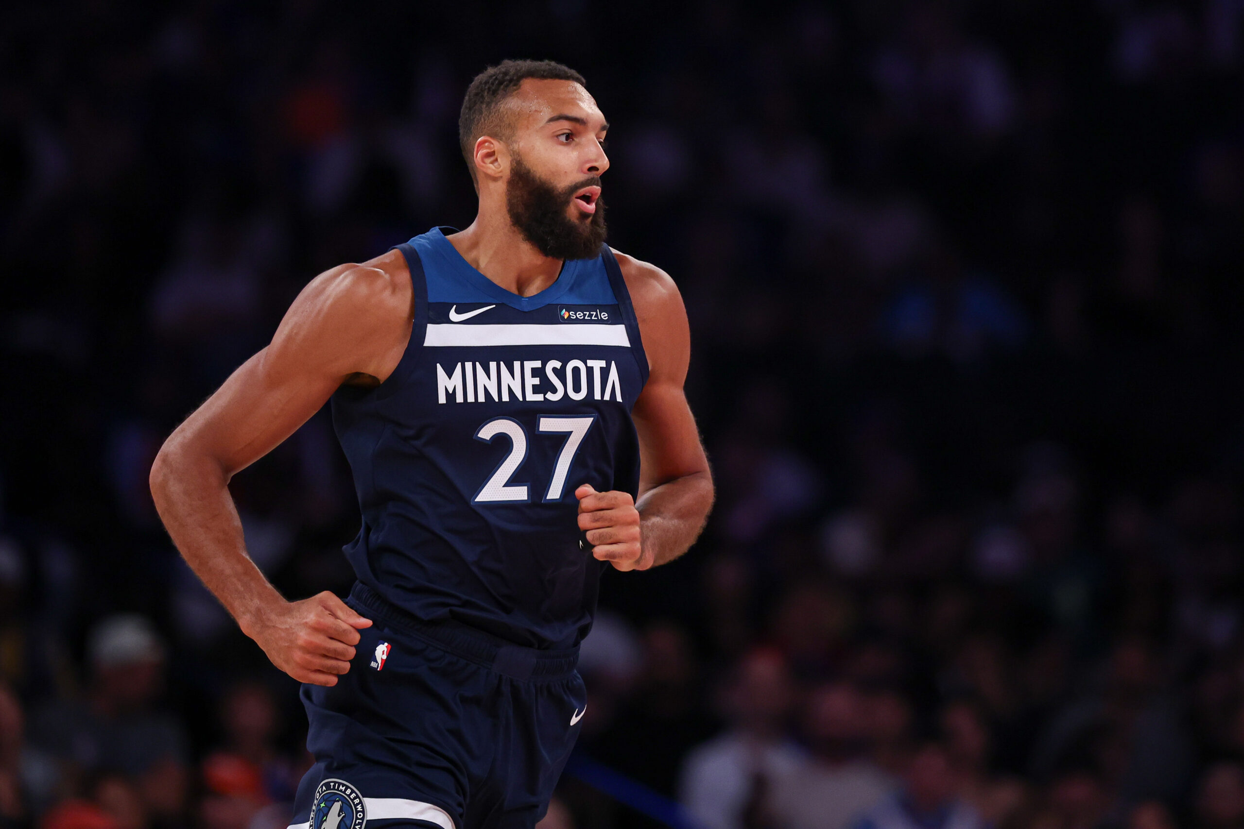 Oct 13, 2024; New York, New York, USA; Minnesota Timberwolves center Rudy Gobert (27) runs up court after a basket against the New York Knicks during the first half at Madison Square Garden.