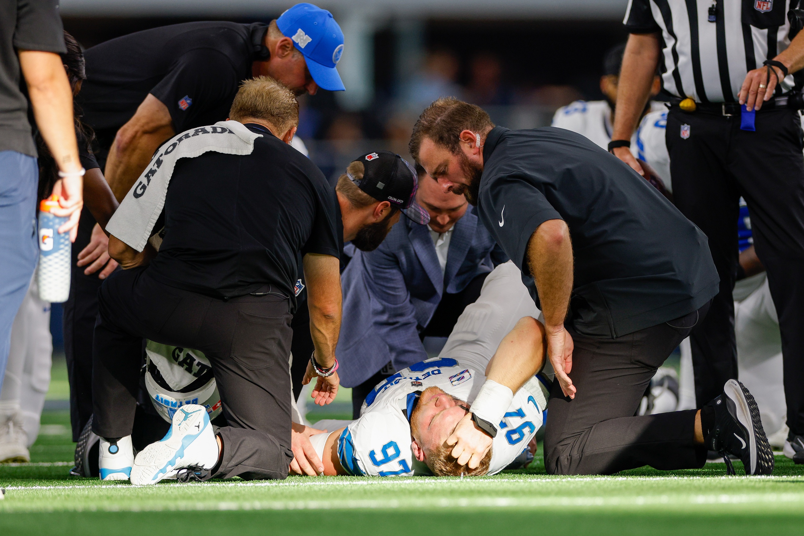 Oct 13, 2024; Arlington, Texas, USA; Detroit Lions defensive end Aidan Hutchinson (97) is injured during a sack against the Dallas Cowboys during the third quarter at AT&T Stadium.