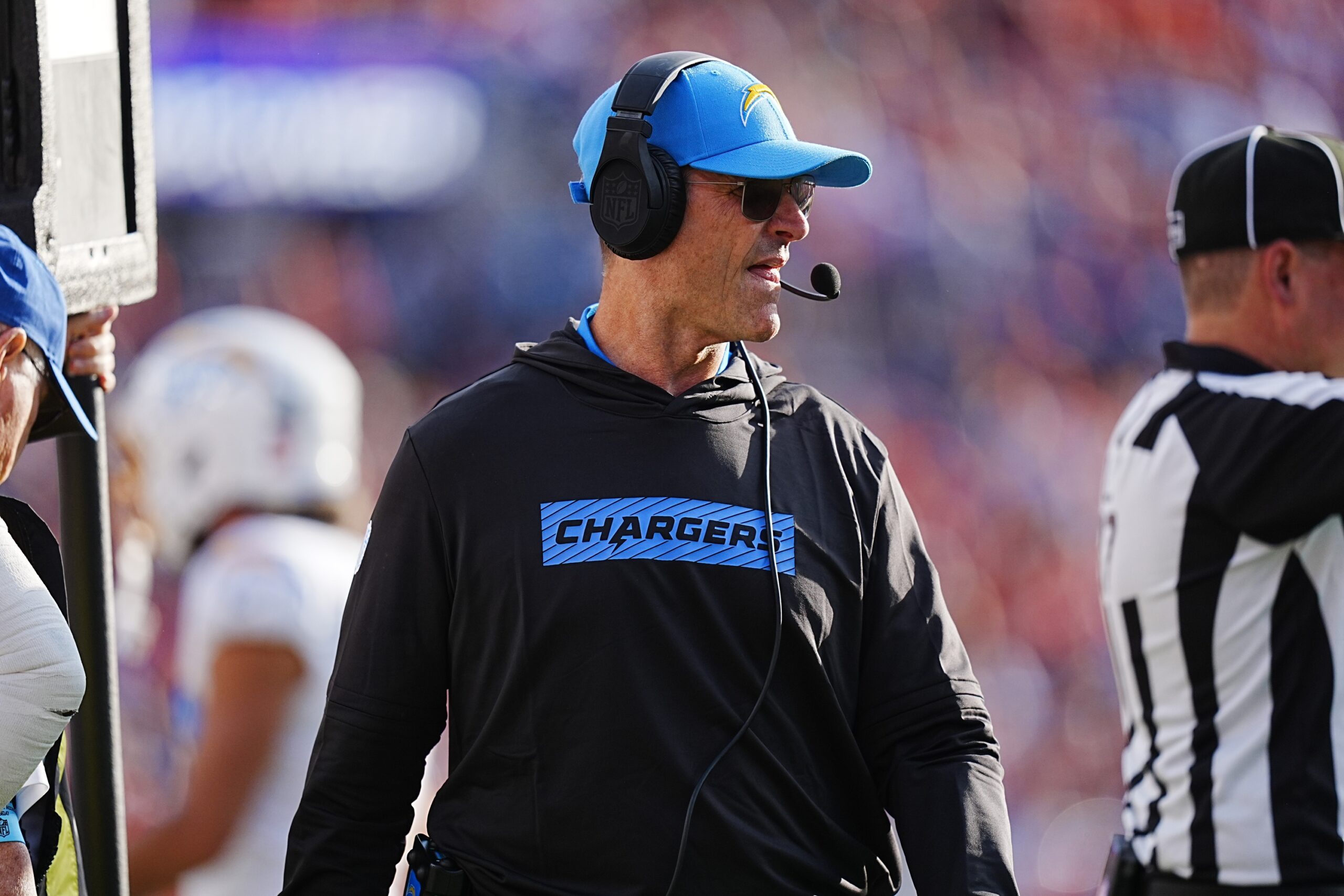 Oct 13, 2024; Denver, Colorado, USA; Los Angeles Chargers head coach Jim Harbaugh walks the sidelines n the second half against the Denver Broncos at Empower Field at Mile High. Mandatory Credit: Ron Chenoy-Imagn Images