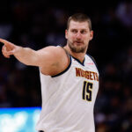 Oct 13, 2024; Denver, Colorado, USA; Denver Nuggets center Nikola Jokic (15) reacts after a play in the second quarter against the Phoenix Suns at Ball Arena.