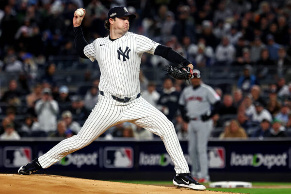 Oct 15, 2024; Bronx, New York, USA; New York Yankees pitcher Gerrit Cole (45) throws a pitch during the first inning against the Cleveland Guardians in game two of the ALCS for the 2024 MLB Playoffs at Yankee Stadium. Mandatory Credit: Vincent Carchietta-Imagn Images