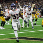 Oct 17, 2024; New Orleans, Louisiana, USA; Denver Broncos running back Javonte Williams (33) scores a touchdown against the New Orleans Saints during the second quarter at Caesars Superdome.