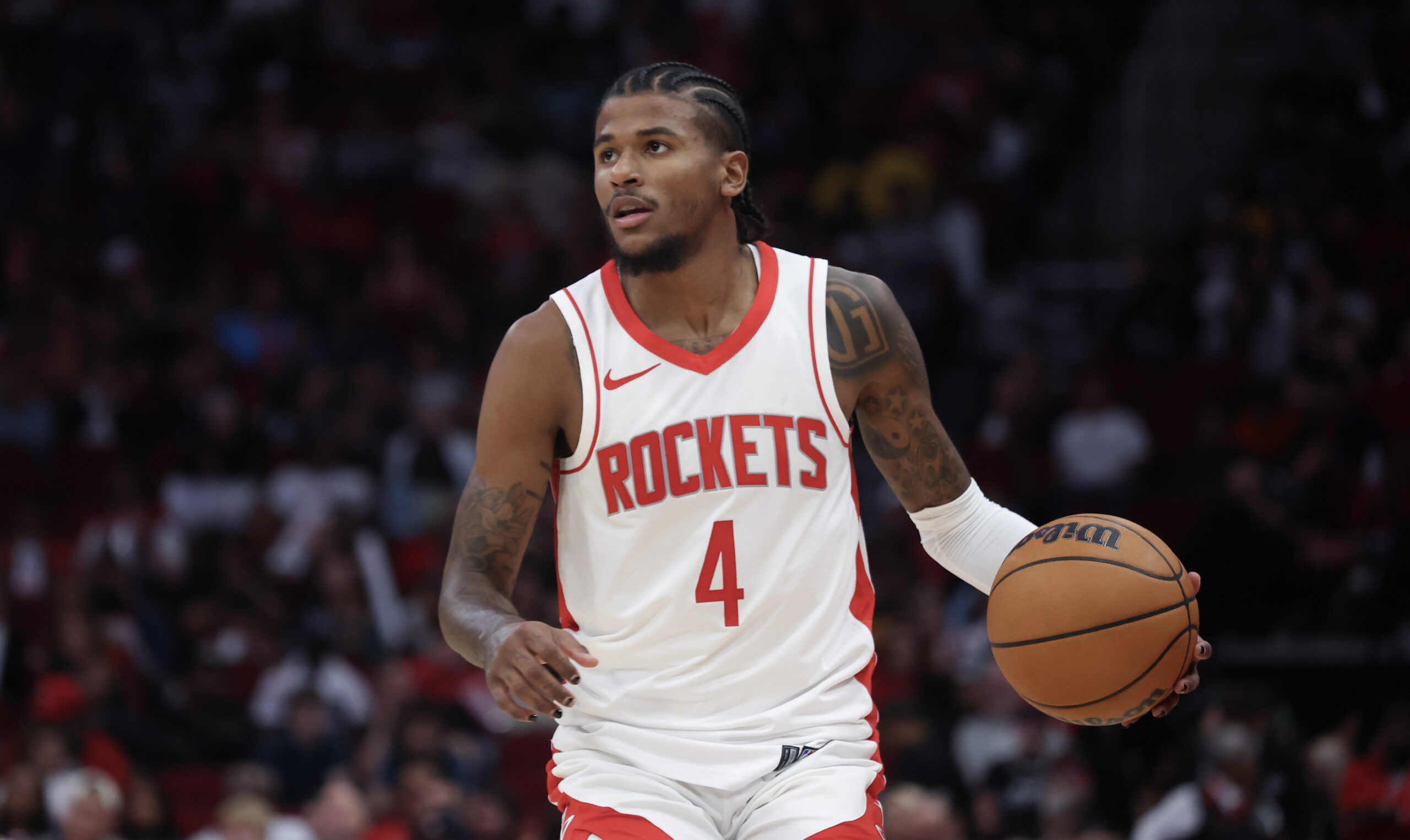 Oct 17, 2024; Houston, Texas, USA; Houston Rockets guard Jalen Green (4) dribbles against the San Antonio Spurs in the fourth quarter at Toyota Center.