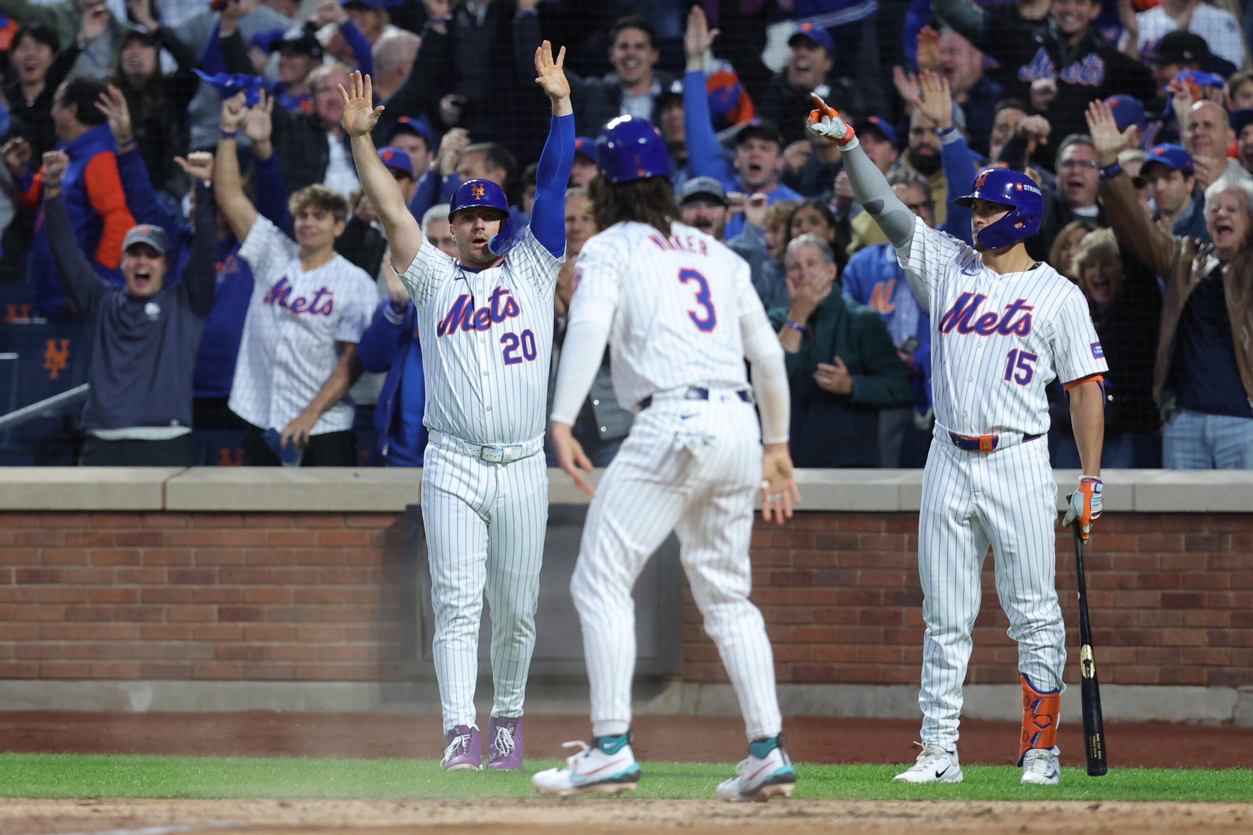 Oct 18, 2024; New York City, New York, USA; New York Mets first base Pete Alonso (20) celebrates a scoring a run in the third inning against the Los Angeles Dodgers during game five of the NLCS for the 2024 MLB playoffs at Citi Field.