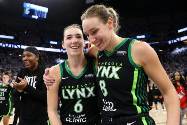 Oct 18, 2024; Minneapolis, Minnesota, USA; Minnesota Lynx forward Bridget Carleton (6) and forward Alanna Smith (8) celebrate their teams win after game four of the 2024 WNBA Finals against the New York Liberty at Target Center.