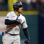 Oct 19, 2024; Cleveland, Ohio, USA; New York Yankees outfielder Juan Soto (22) celebrates while running the bases after hitting a three run home run during the tenth inning against the Cleveland Guardians during game five of the ALCS for the 2024 MLB playoffs at Progressive Field. Mandatory Credit: Scott Galvin-Imagn Images