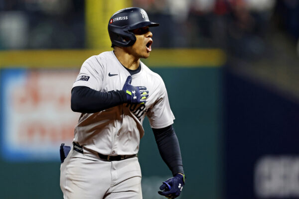 Oct 19, 2024; Cleveland, Ohio, USA; New York Yankees outfielder Juan Soto (22) celebrates while running the bases after hitting a three run home run during the tenth inning against the Cleveland Guardians during game five of the ALCS for the 2024 MLB playoffs at Progressive Field. Mandatory Credit: Scott Galvin-Imagn Images