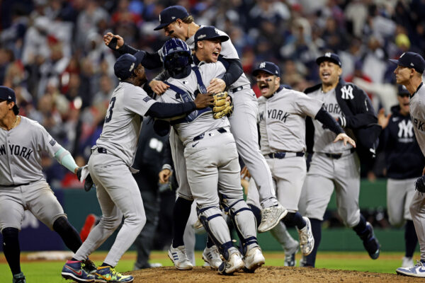 Oct 19, 2024; Cleveland, Ohio, USA; The New York Yankees celebrates after beating the Cleveland Guardians during game five of the ALCS for the 2024 MLB playoffs at Progressive Field. Mandatory Credit: Scott Galvin-Imagn Images