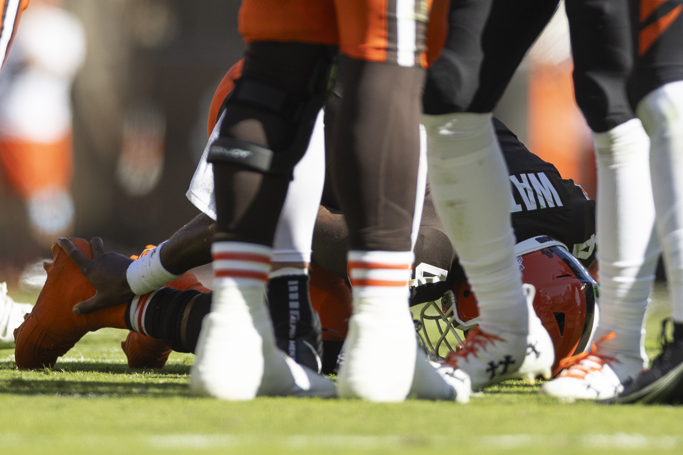 Oct 20, 2024; Cleveland, Ohio, USA; Cleveland Browns quarterback Deshaun Watson (4) holds his ankle from a torn Achilles during the second quarter against the Cincinnati Bengals at Huntington Bank Field. Mandatory Credit: Scott Galvin-Imagn Images