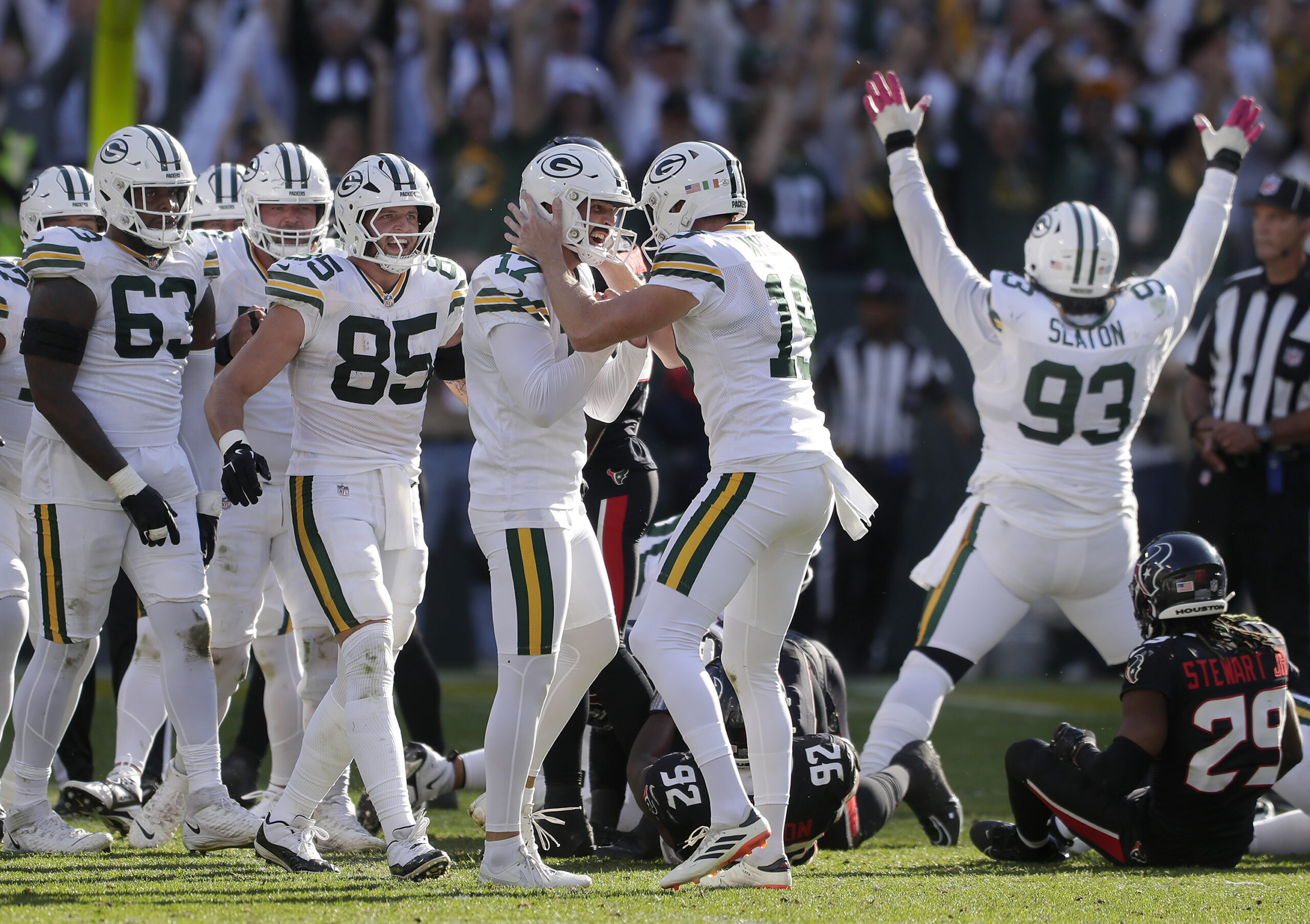 Oct 20, 2024; Green Bay, Wisconsin, USA; Green Bay Packers place kicker Brandon McManus (17) and Green Bay Packers punter Daniel Whelan (19) celebrate a game winning 45 yard field against the Houston Texans.